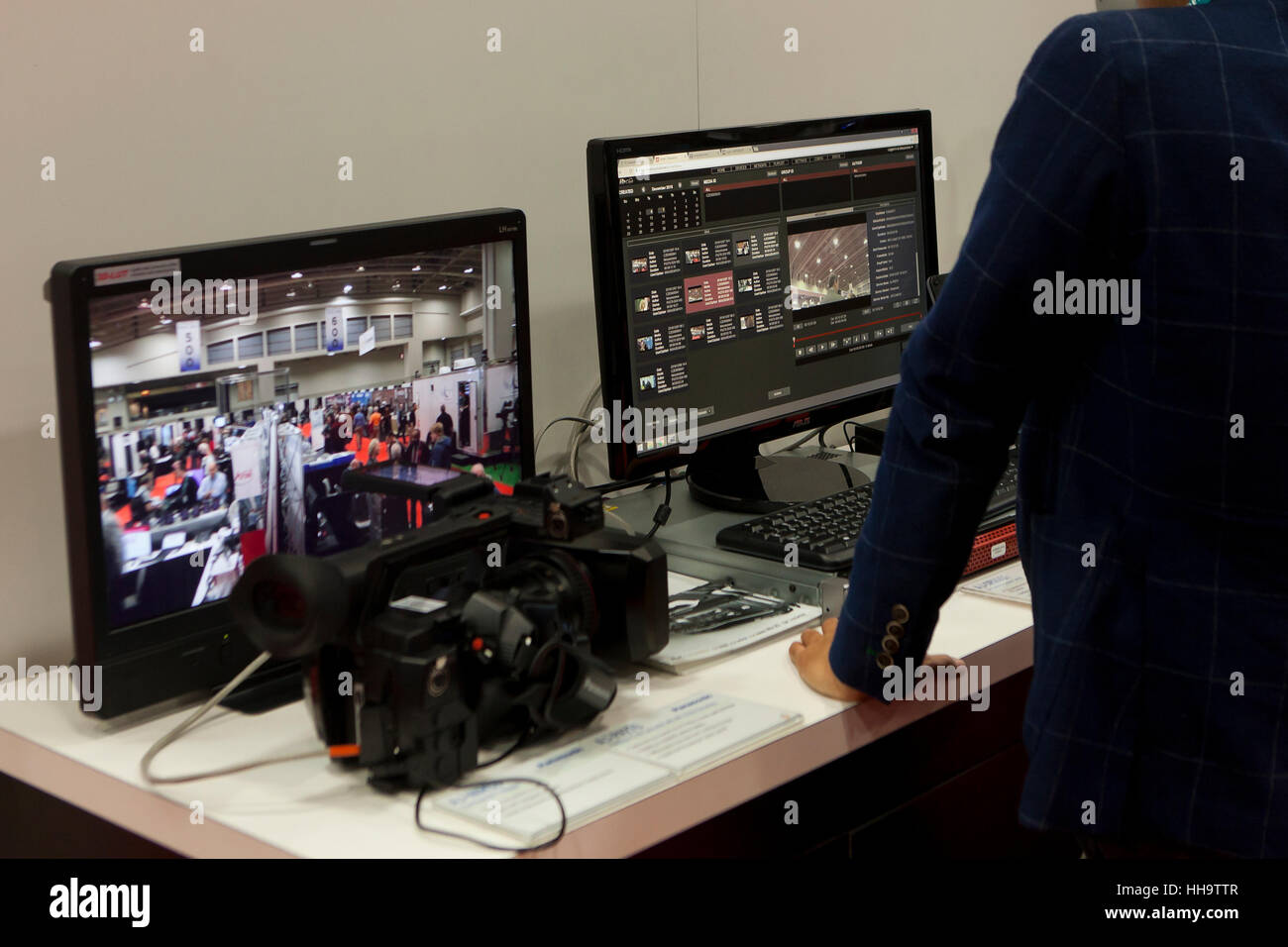 Computer workstation showing video editing software on screen - USA Stock Photo