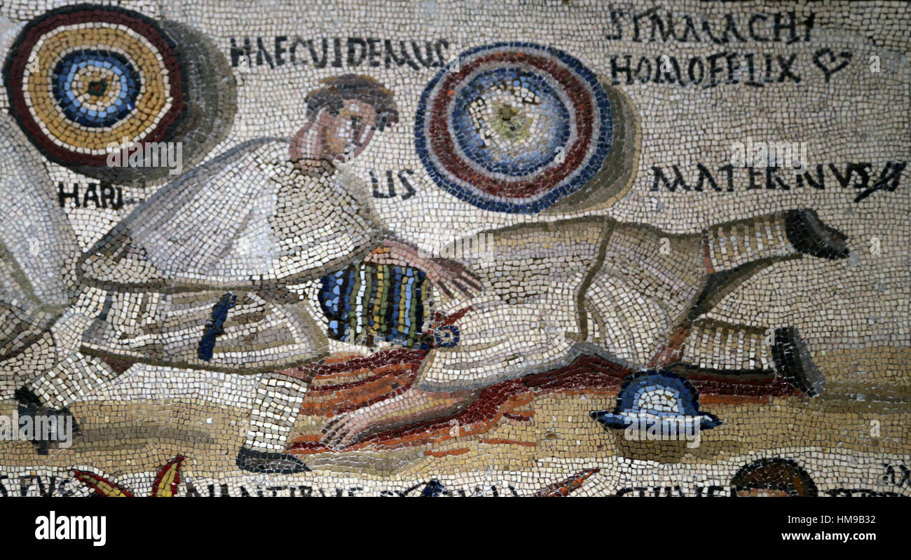 Gladiator fight. Mosaic. 3rd century. Rome. Defeated Maternus, with crossed-out O, simbol of deat. Spain. National Archaeological Museum, Madrid. Stock Photo