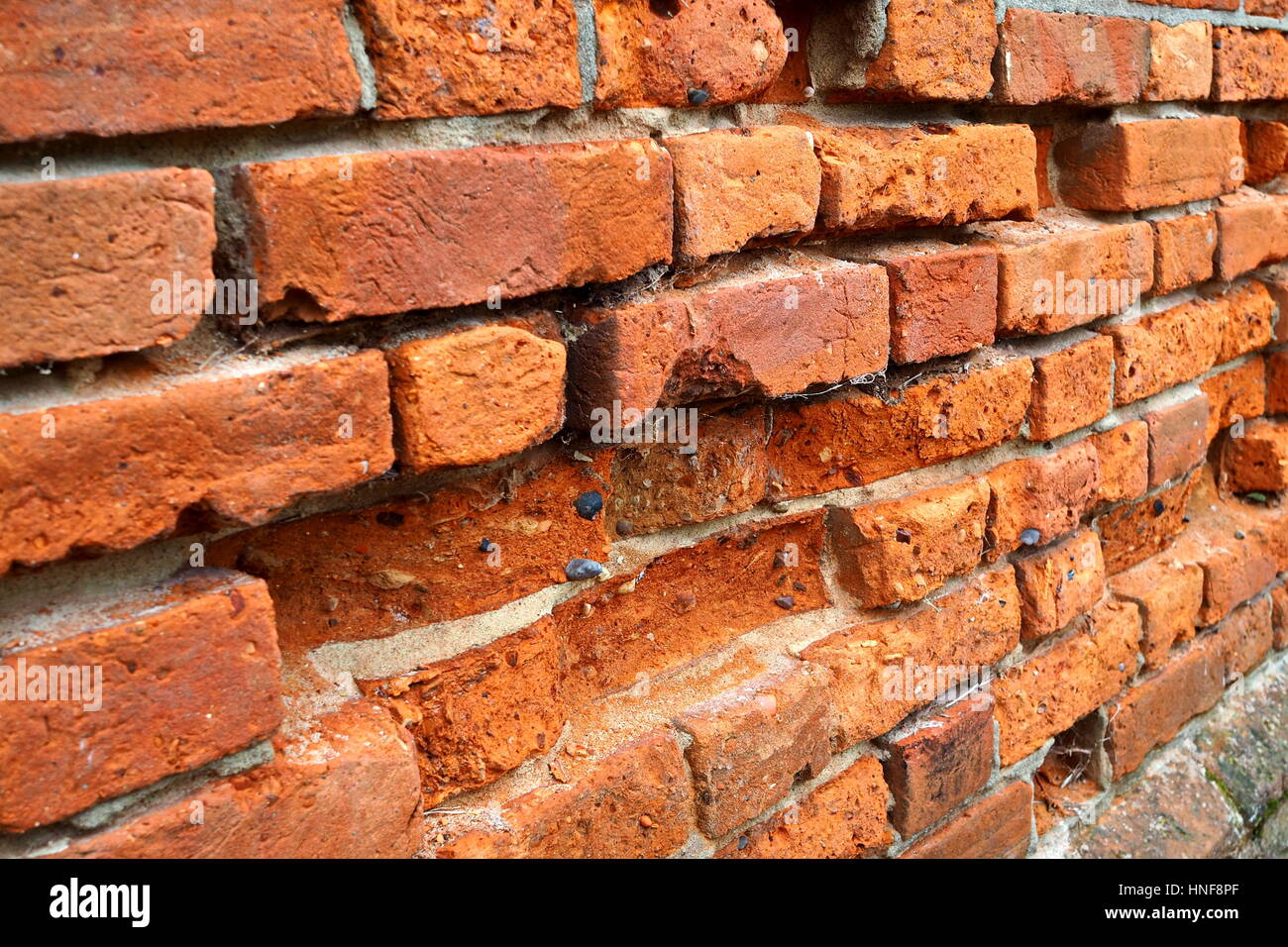 Crumbling brick wall Stock Photo