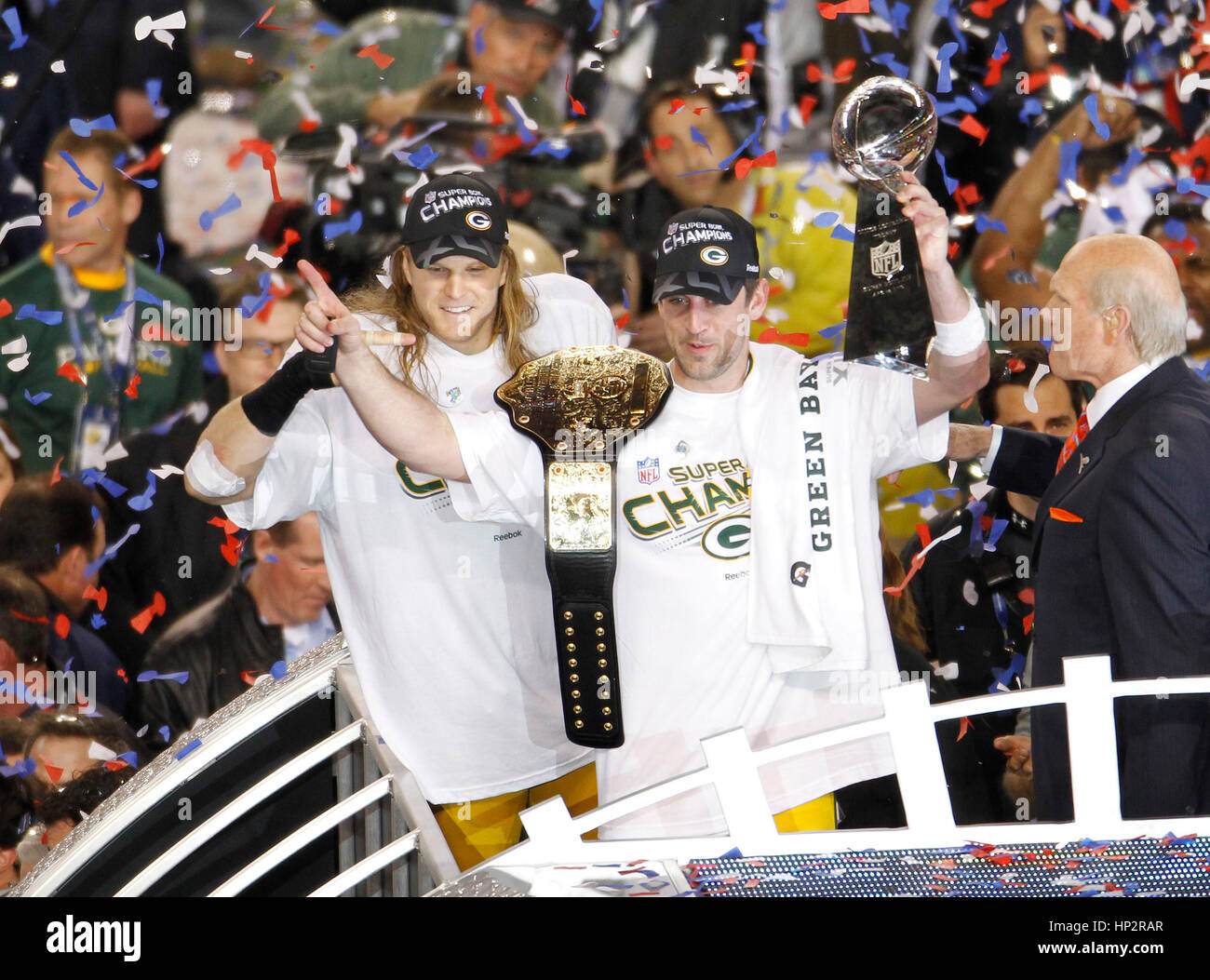 Green Bay Packers quarterback Aaron Rodgers (R) and linebacker Clay Matthews celebrate with the Vince Lombardi Trophy after defeating the Pittsburgh Steelers in the NFL's Super Bowl XLV football game in Arlington, Texas, February 6, 2011. Rodgers was voted MVP of the game. Photo by Francis Specker Stock Photo