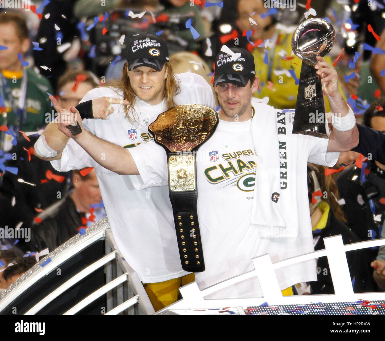 Green Bay Packers quarterback Aaron Rodgers (R) and linebacker Clay Matthews celebrate with the Vince Lombardi Trophy after defeating the Pittsburgh Steelers in the NFL's Super Bowl XLV football game in Arlington, Texas, February 6, 2011. Rodgers was voted MVP of the game. Photo by Francis Specker Stock Photo