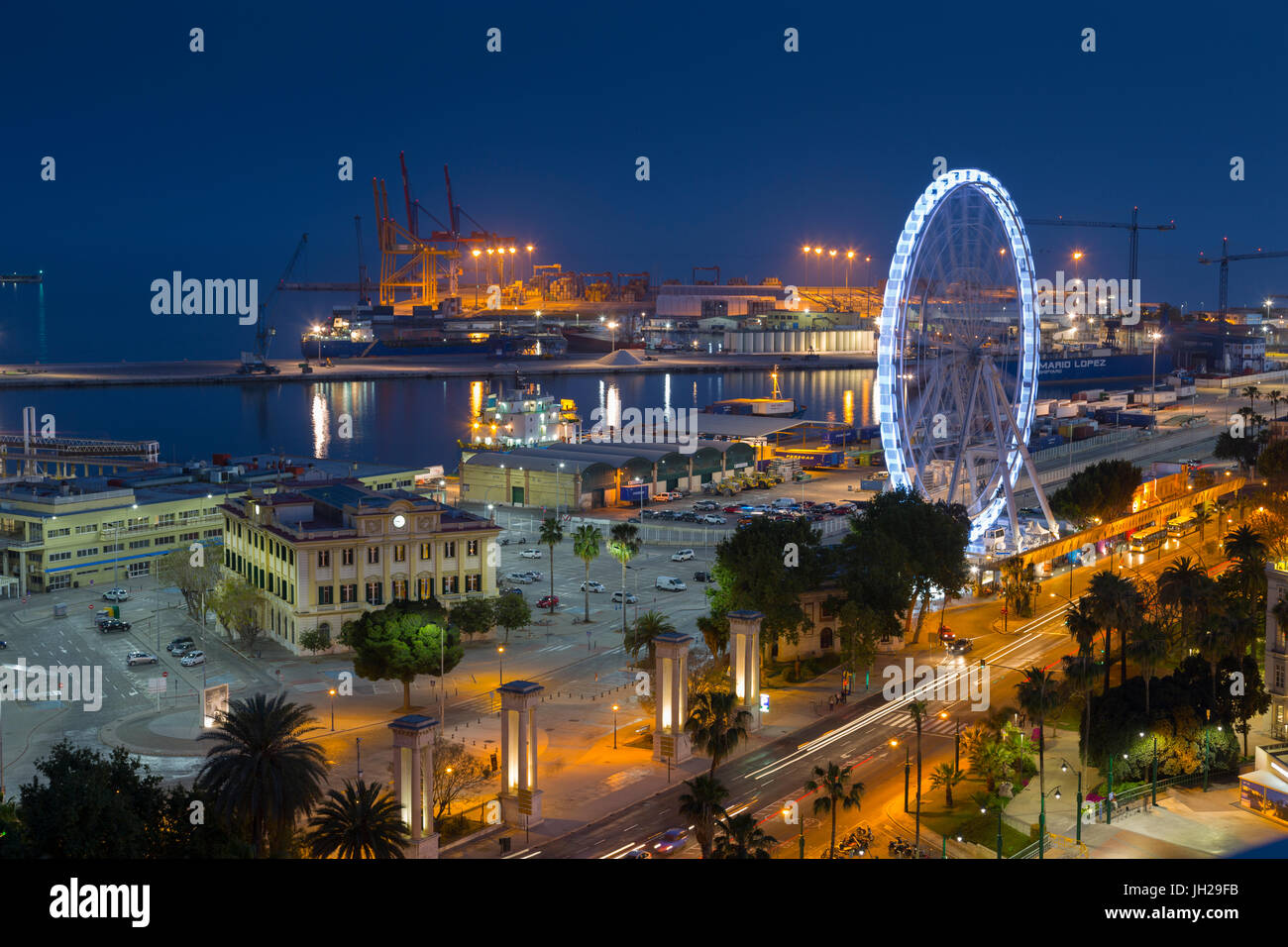 Elevated view of Malaga Marina and ferris wheel at dusk, Malaga, Costa del Sol, Andalusia, Spain, Europe Stock Photo