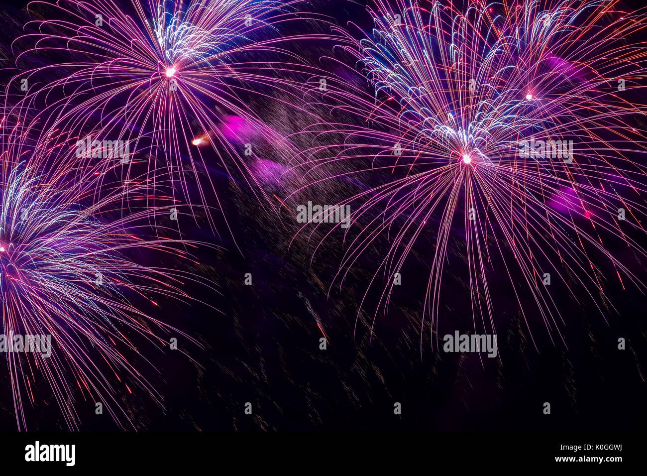 Close-up of vivid purple fireworks with sparks. Explosive pyrotechnic devices for aesthetic and entertainment purposes, art. Colored fireworks, holiday background Stock Photo