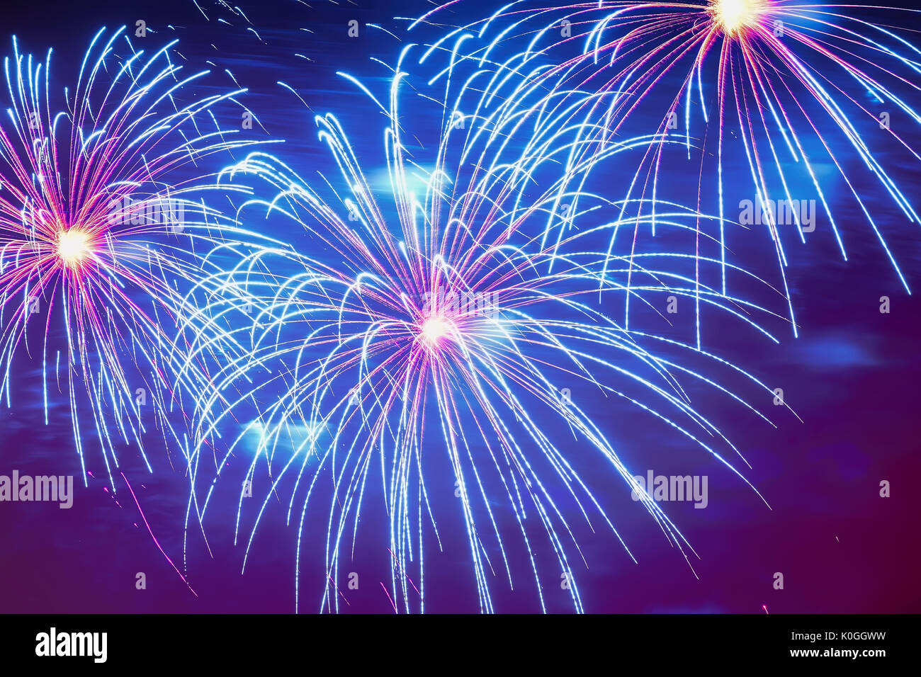 Close-up of vivid blue fireworks with sparks. Explosive pyrotechnic devices for aesthetic and entertainment purposes, art. Colored fireworks, holiday background Stock Photo