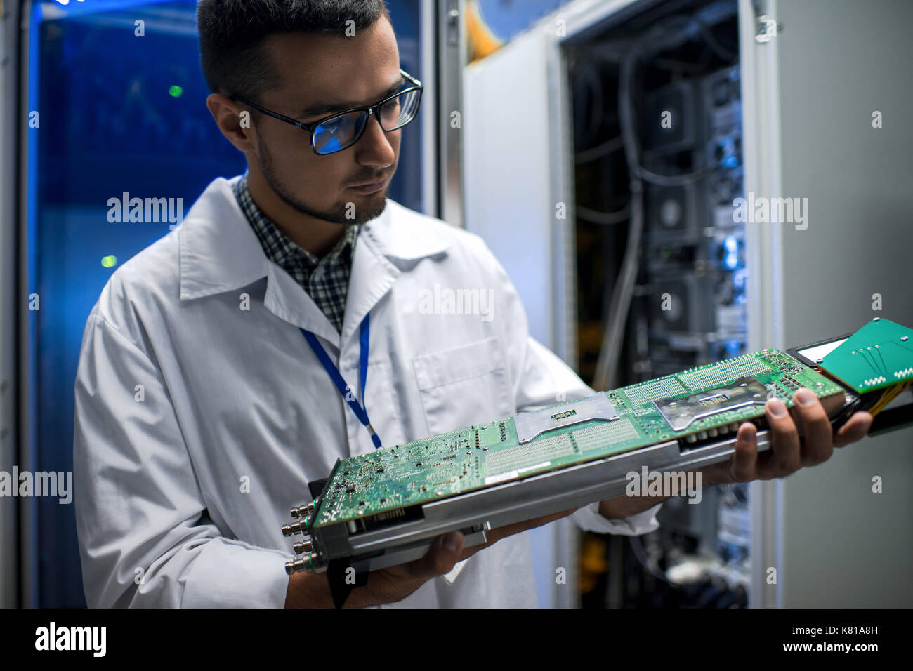 Scientist Inspecting Supercomputer Stock Photo