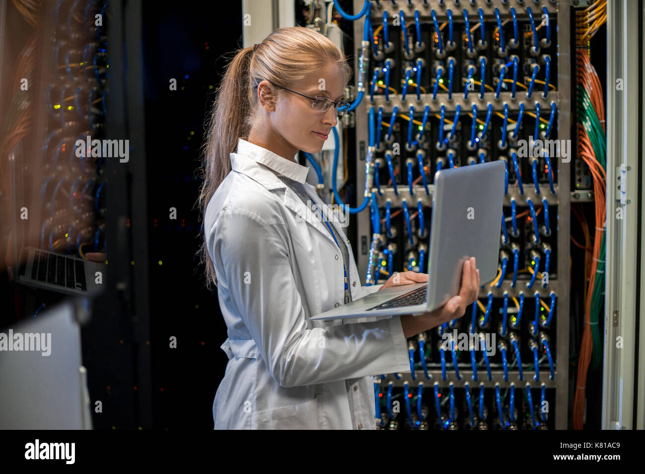 Woman Working with Supercomputer Stock Photo