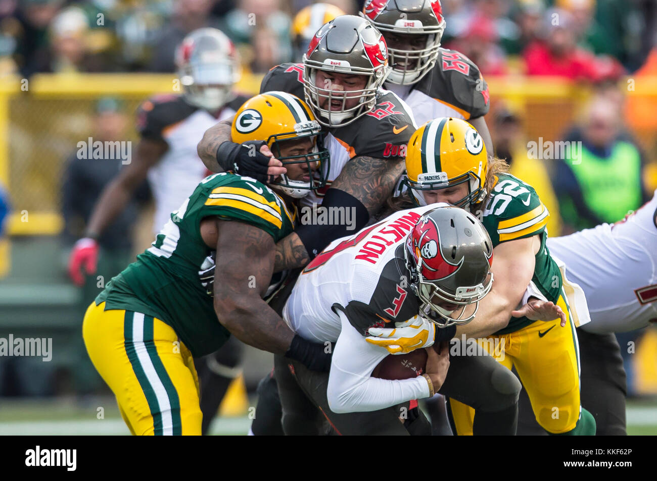 December 3, 2017: Green Bay Packers outside linebacker Clay Matthews #52 and Green Bay Packers defensive end Mike Daniels #76 sack Tampa Bay Buccaneers quarterback Jameis Winston #3 during the NFL Football game between the Tampa Bay Buccaneers and the Green Bay Packers at Lambeau Field in Green Bay, WI. Packers defeated the Buccaneers in overtime 26-20. John Fisher/CSM Stock Photo