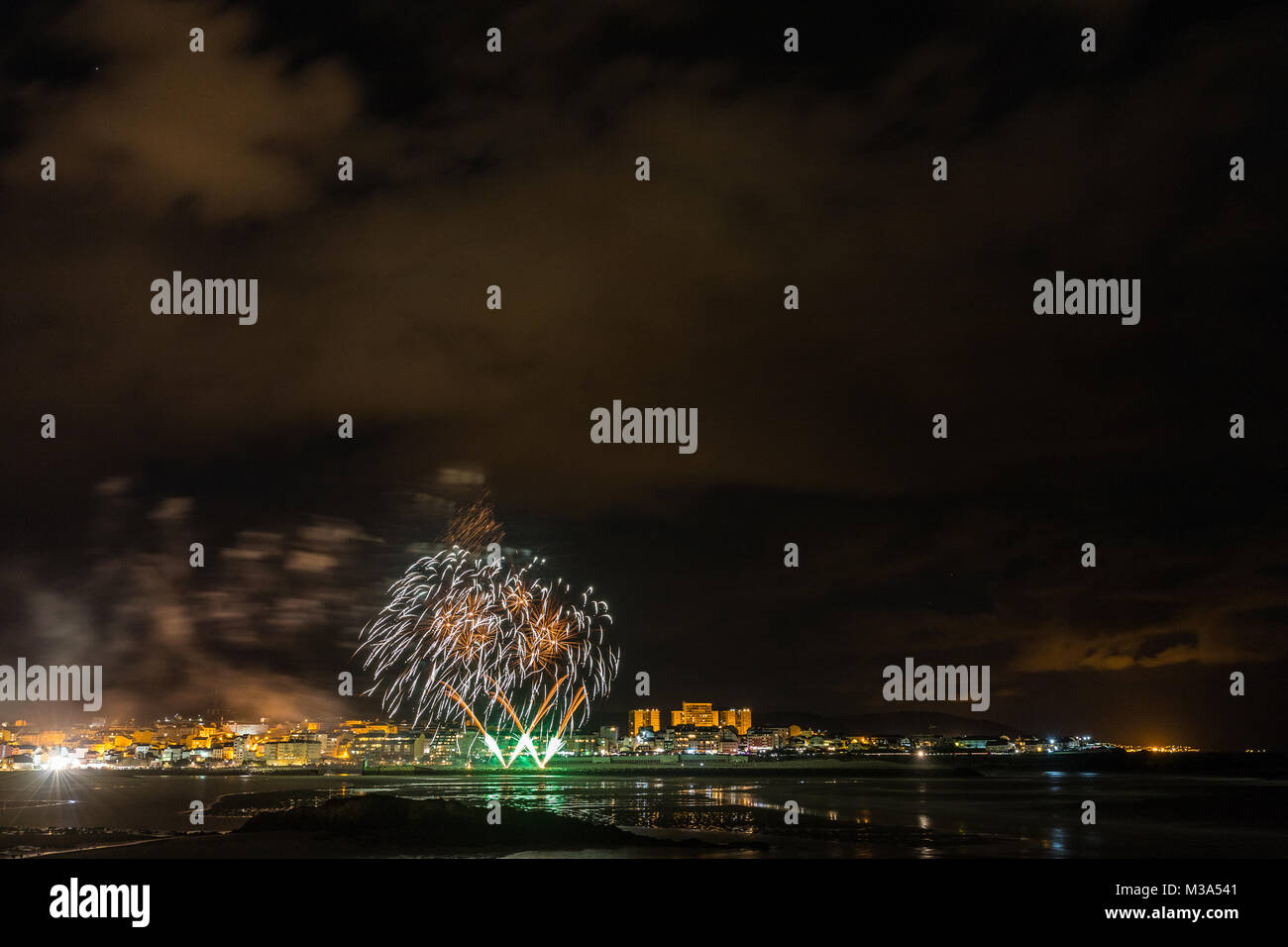 holiday in the Galician coast, where at night celebrating the festivities in the town of Foz, spain, we contemplate the fireworks worthy of admiration Stock Photo