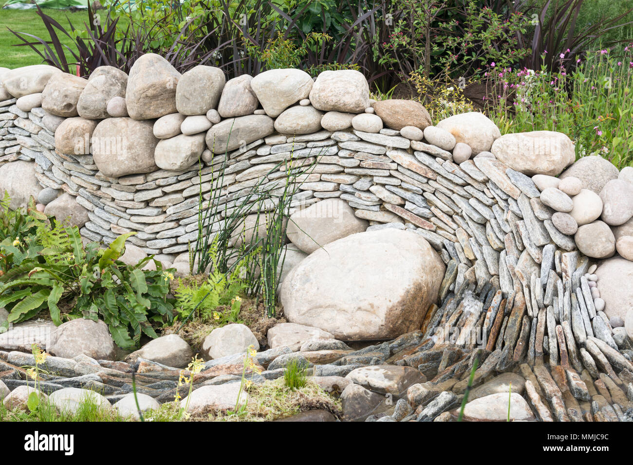 Curved dry stone wall Stock Photo