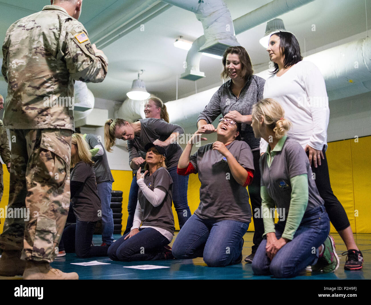 Military Police spouses practice defensive pressure points on each other Sept. 20 during the MP Spouses Challenge at Fort Leonard Wood, Missouri. MPs attended events throughout the week to mark the regiment's 75th anniversary. (U.S. Army photo by Sgt. 1st Class Jacob Boyer/Released) Stock Photo