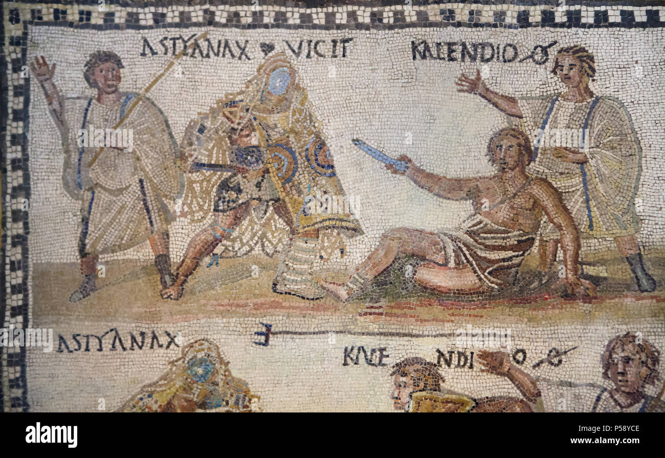 Gladiator fight depicted in the Roman mosaic from the 3rd century AD on display in the National Archaeological Museum (Museo Arqueológico Nacional) in Madrid, Spain. The secutor (Roman armed gladiator) fighting versus the retiarius (Roman net fighter). According to the Latin inscription, the secutor Astyanax and the retiarius Kalendio are engaged in mortal combat. The lanista (gladiator trainer) cheers them on. Stock Photo