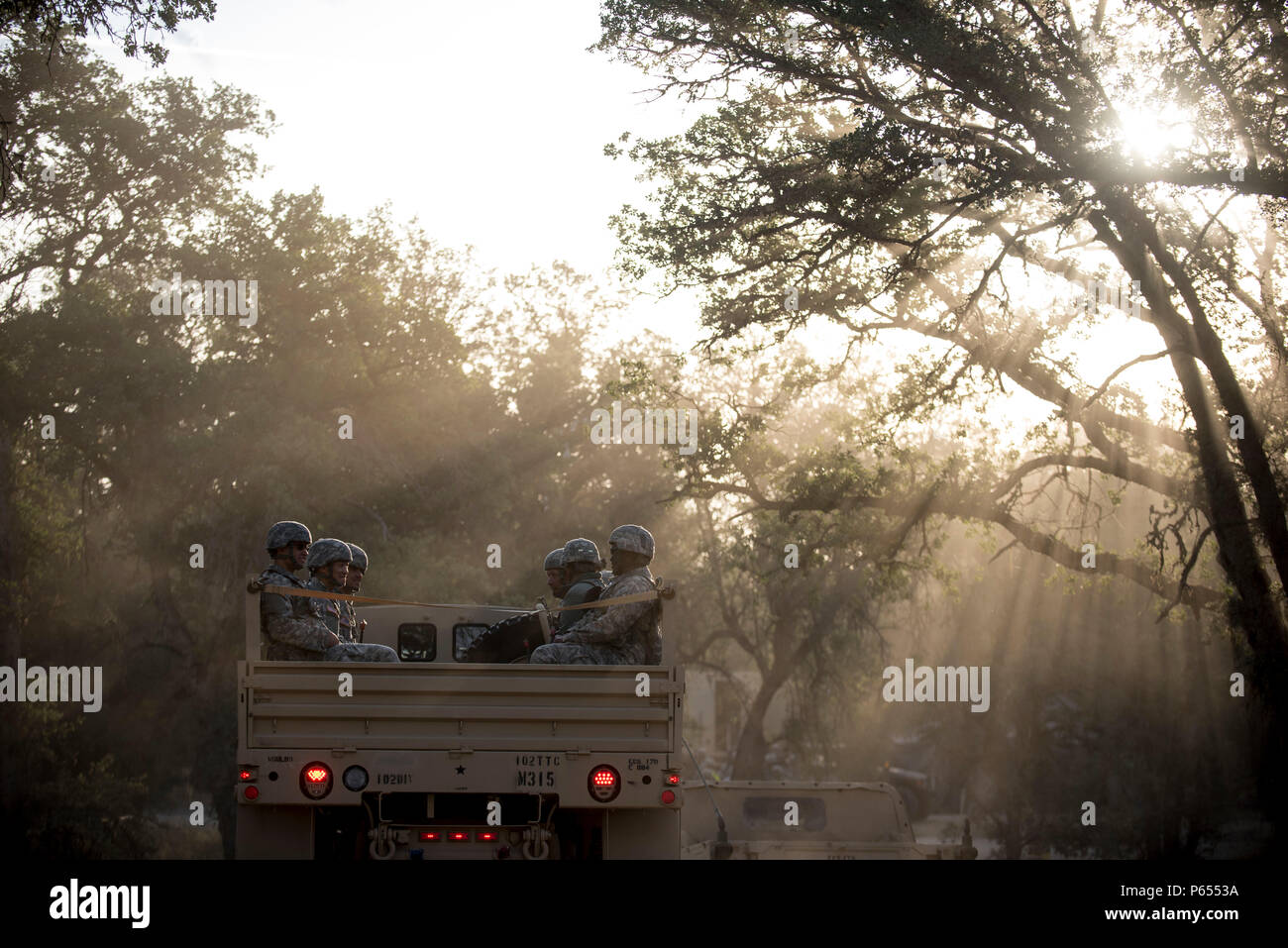 A group of U.S. Army Reserve Soldiers ride on the back of a troop-carrier truck after eating breakfast to go training on Fort Hunter-Liggett, California, May 3. Approximately 80 units from across the U.S. Army Reserve, Army National Guard and active Army are participating in the 84th Training Command's second Warrior Exercise this year, WAREX 91-16-02, hosted by the 91st Training Division at Fort Hunter-Liggett, California. (U.S. Army photo by Master Sgt. Michel Sauret) Stock Photo