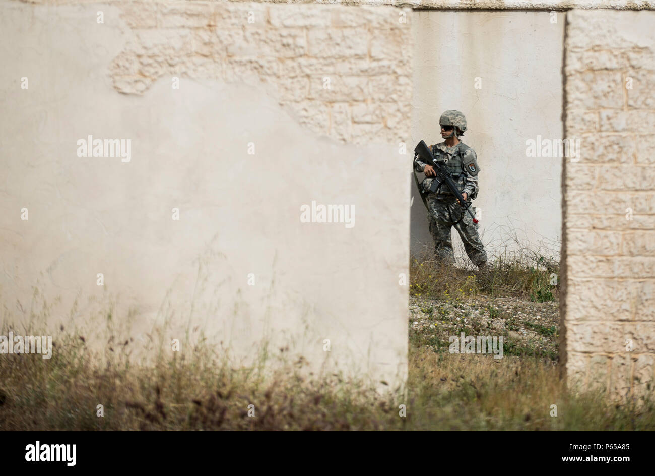 A U.S. Army Reserve Soldiers from the 223rd Maintenance Company, of Grand Prairie, Texas, stands guard during a counter-IED training lane at Fort Hunter-Liggett, California, May 3. Approximately 80 units from across the U.S. Army Reserve, Army National Guard and active Army are participating in the 84th Training Command's second Warrior Exercise this year, WAREX 91-16-02, hosted by the 91st Training Division at Fort Hunter-Liggett, California. (U.S. Army photo by Master Sgt. Michel Sauret) Stock Photo