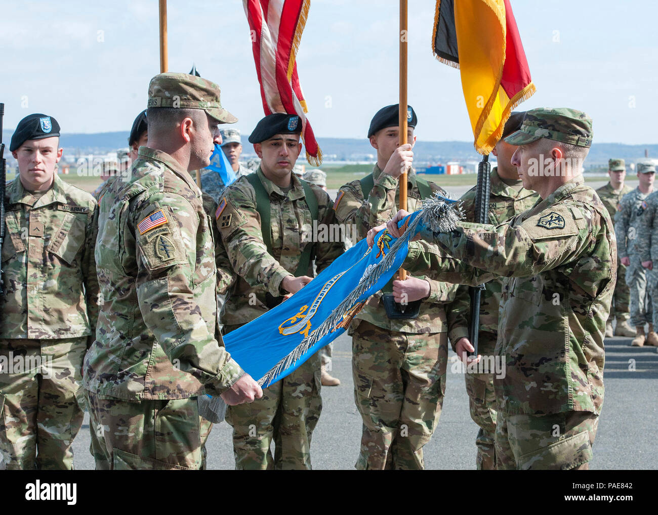 Command Sgt. Major Christopher Matthews and Lt. Col. James Snyder unfold the new 522nd MI Battalion flag on March 24, 2016 during the activation ceremony located at Clay Kaserne, Wiesbaden, Germany. (U.S. Army Photo by Visual Information Specialist Susanne Goebel/ Released) Stock Photo