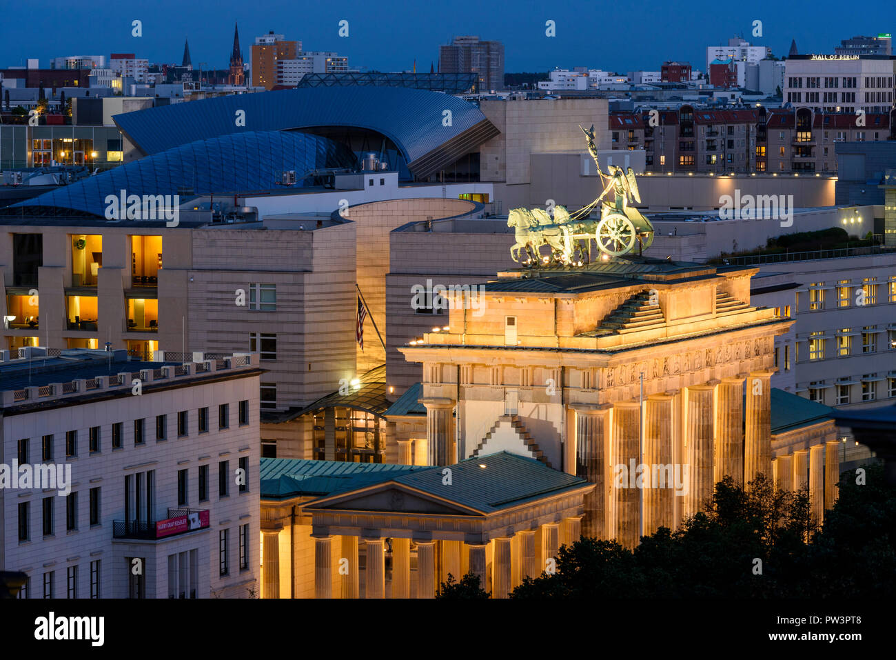 Berlin. Germany. Berlin skyline with elevated view of the  Brandenburg Gate (Brandenburger Tor) illuminated at night, and buildings on Pariser Platz,  Stock Photo