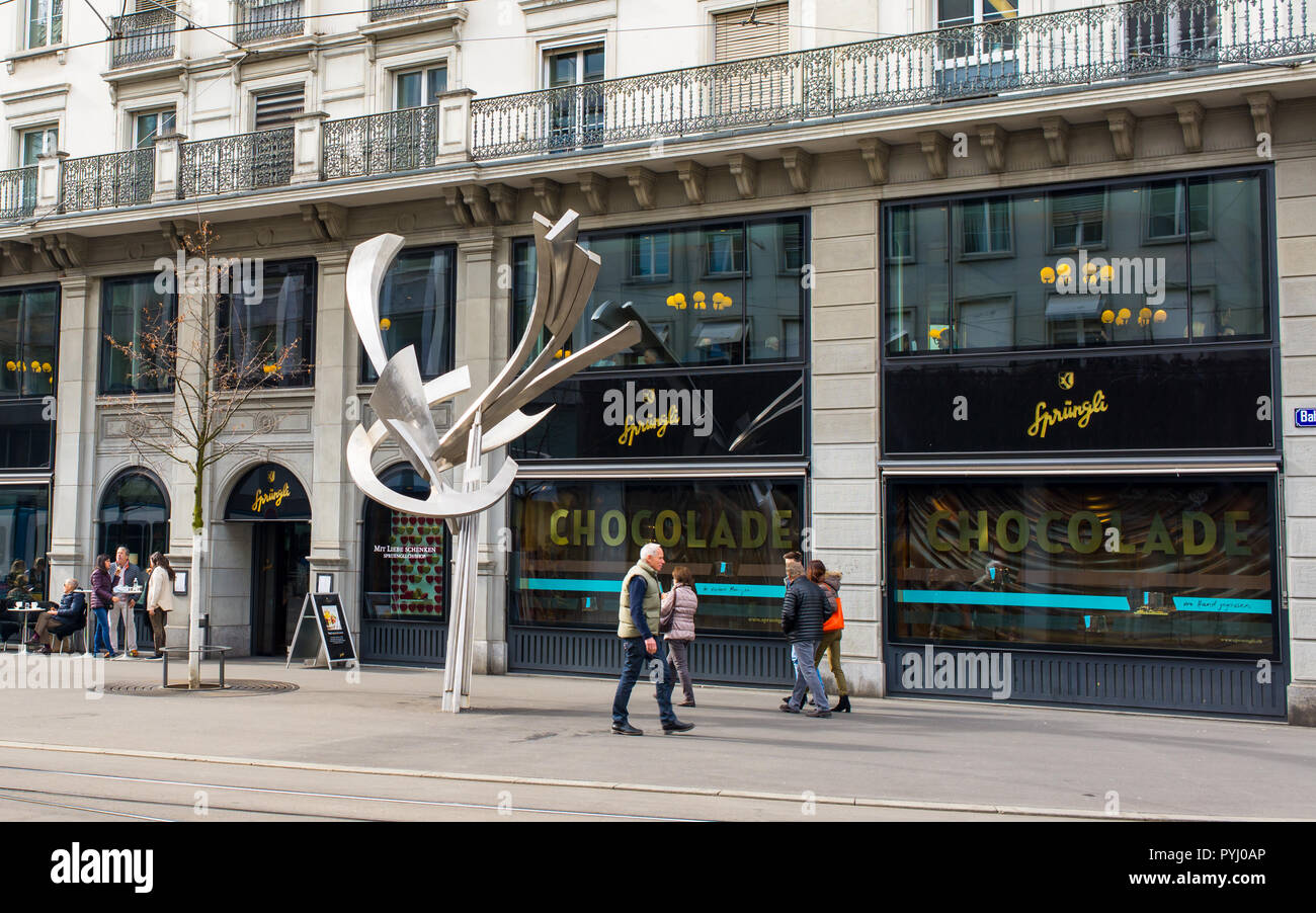 Zurich, Switzerland - March 2017: People walking in front of Confiserie Sprüngli, a Swiss luxury confectionery chocolat shop  manufacturer founded in  Stock Photo