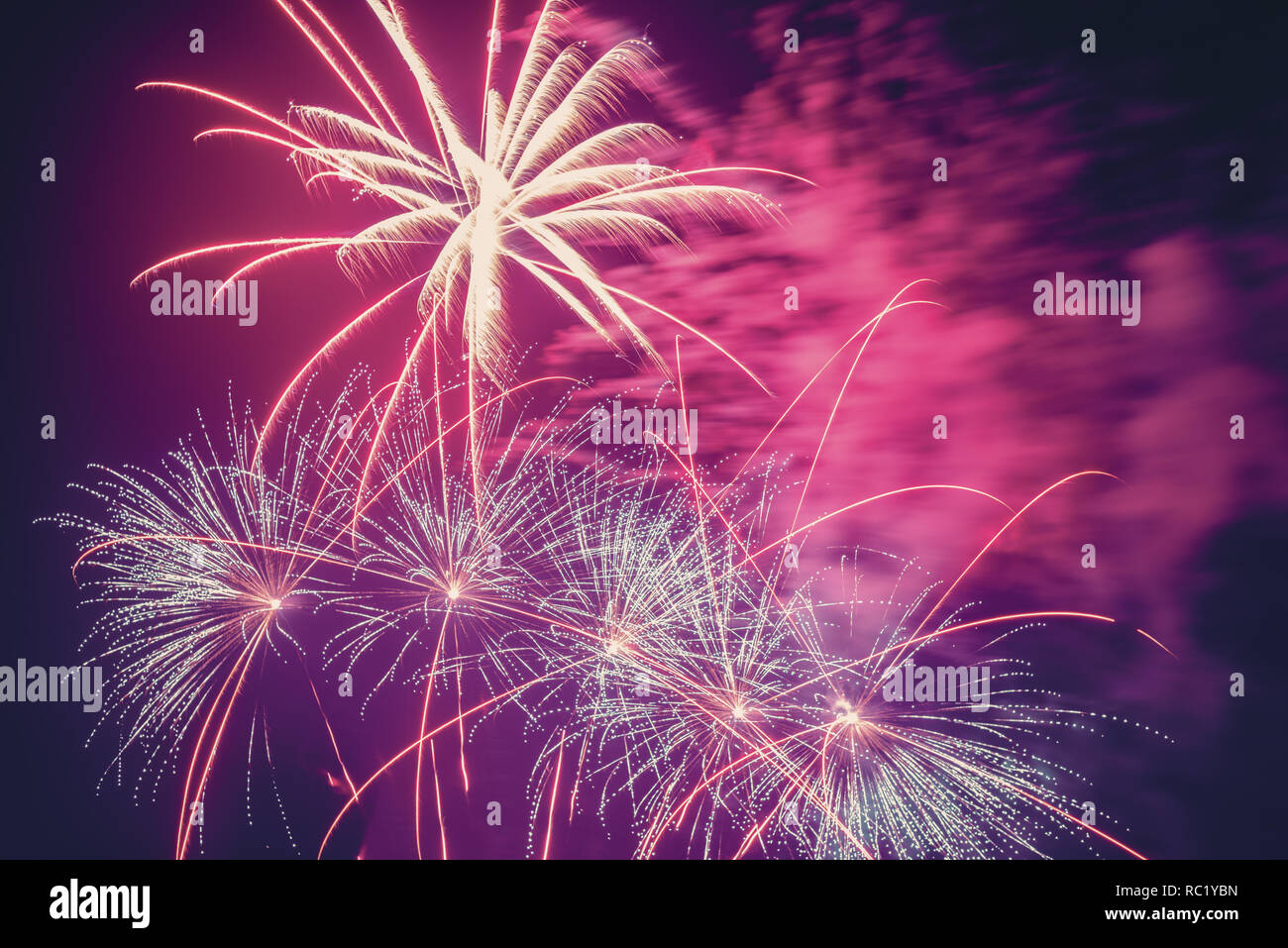 Fireworks are a class of low explosive pyrotechnic devices used for aesthetic and entertainment purposes. Stock Photo