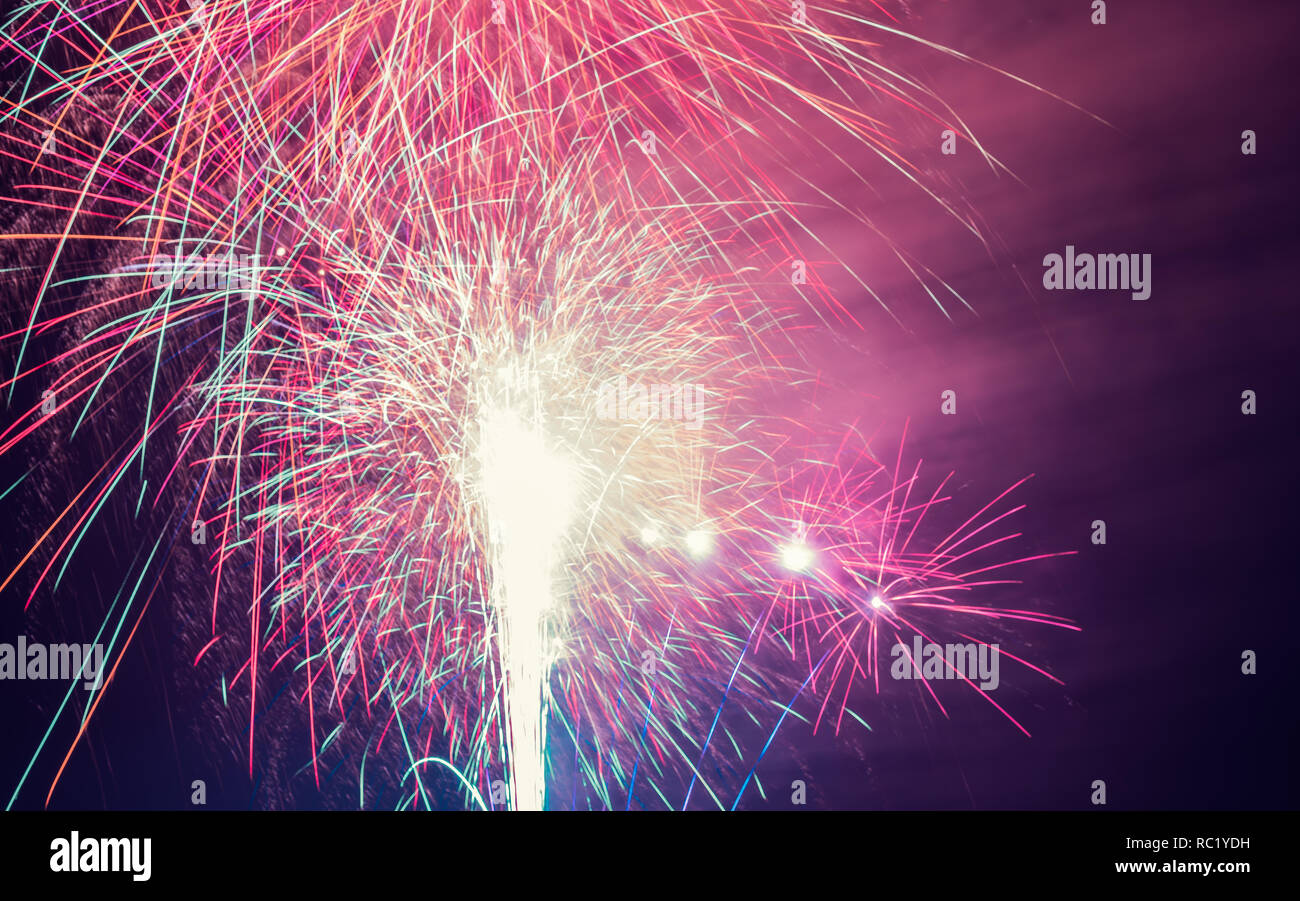 Fireworks are a class of low explosive pyrotechnic devices used for aesthetic and entertainment purposes. Stock Photo