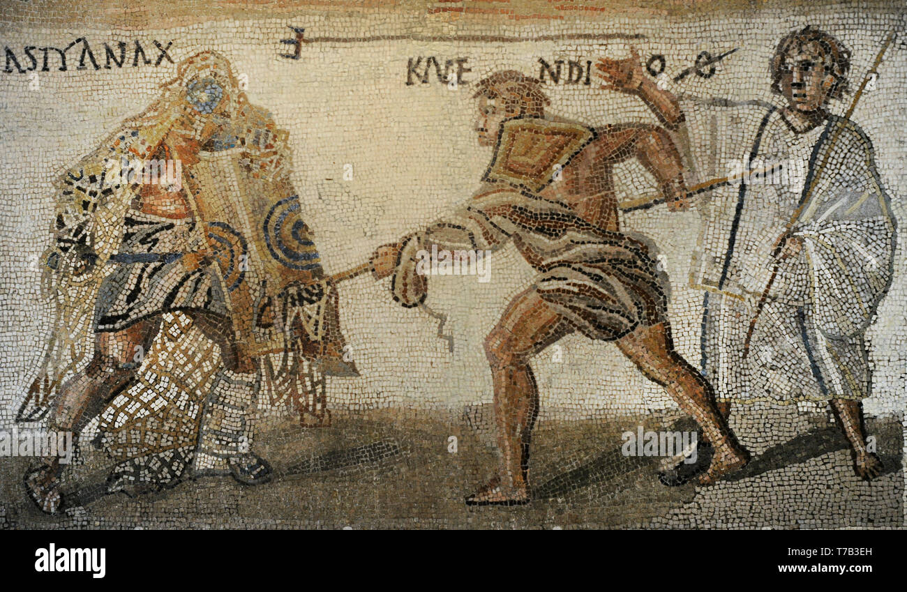 Roman mosaic. Limestones. Secutor versus retiarius. Depiction of the mortal combat between the secutor Astyanax and the retiarius Kalendio. The lanista (gladiator trainer) encourages the combat. Detail of the lower mosaic scene. 3rd century AD. From Rome (Italy). National Archaeological Museum. Madrid. Spain. Stock Photo