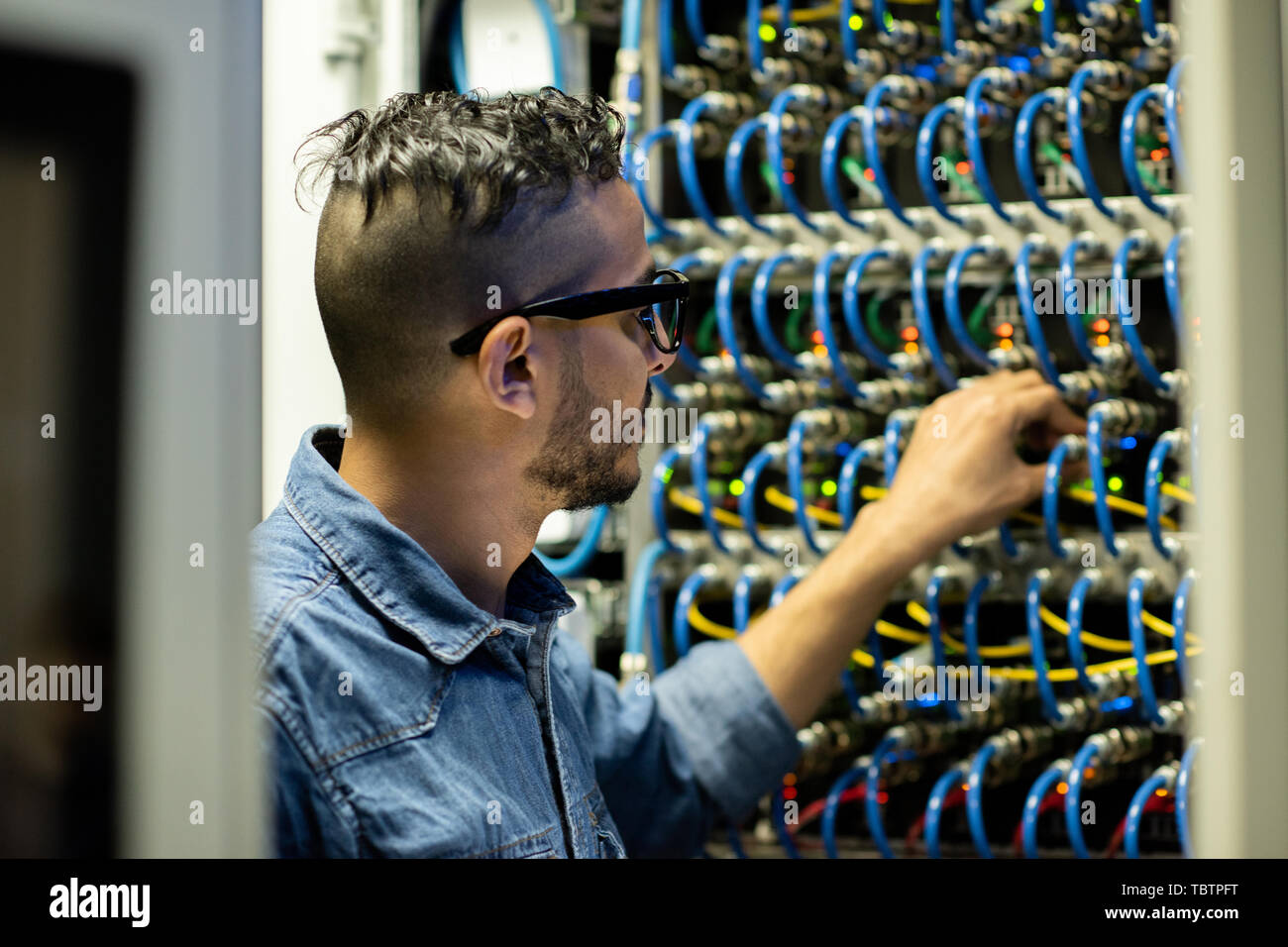 Mainframe engineer analyzing system of database storage Stock Photo