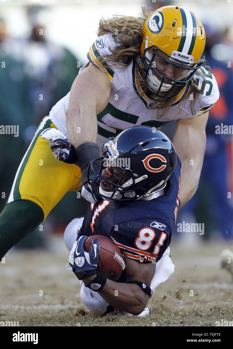 Chicago Bears wide receiver Rashied Davis (81) is brought down by Green Bay Packers linebacker Clay Matthews (52) during the second quarter of their NFC Championship playoff game at Soldier Field in Chicago on January 23, 2011.  UPI /Mark Cowan Stock Photo