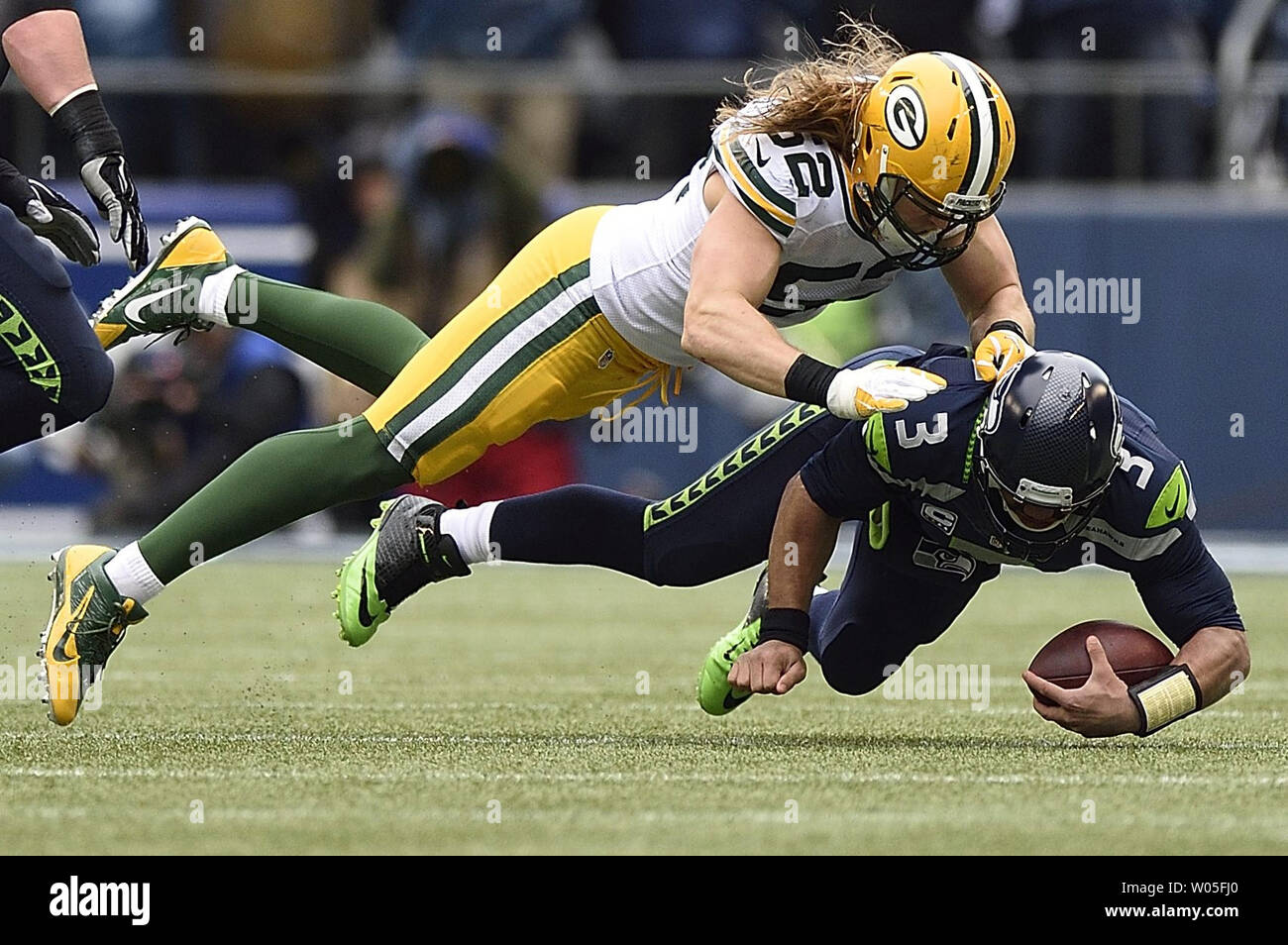 Russell Wilson (3) of the Seattle Seahawks is sacked by Clay Matthews ( 52) of the Green Bay Packers in the NFC Championship game at CenturyLink Field in Seattle, Washington on January 18, 2015. Seattle won 28-22. Photo by Troy Wayrynen/UPI Stock Photo