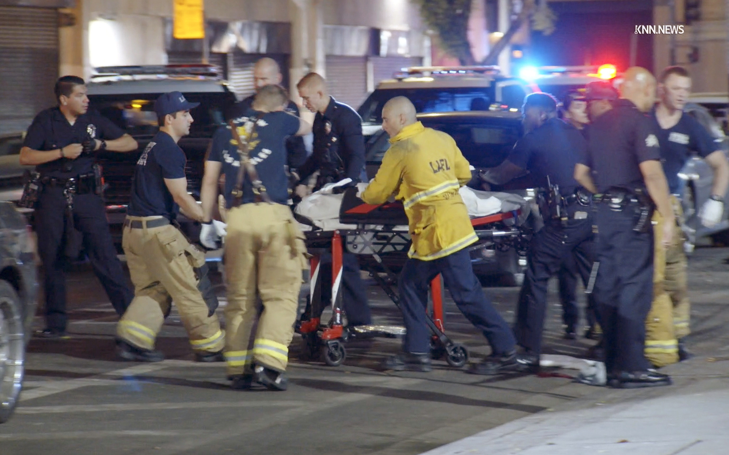 A man is transported by first responders following a stabbing in downtown Los Angeles near Skid Row on Aug. 8, 2024.