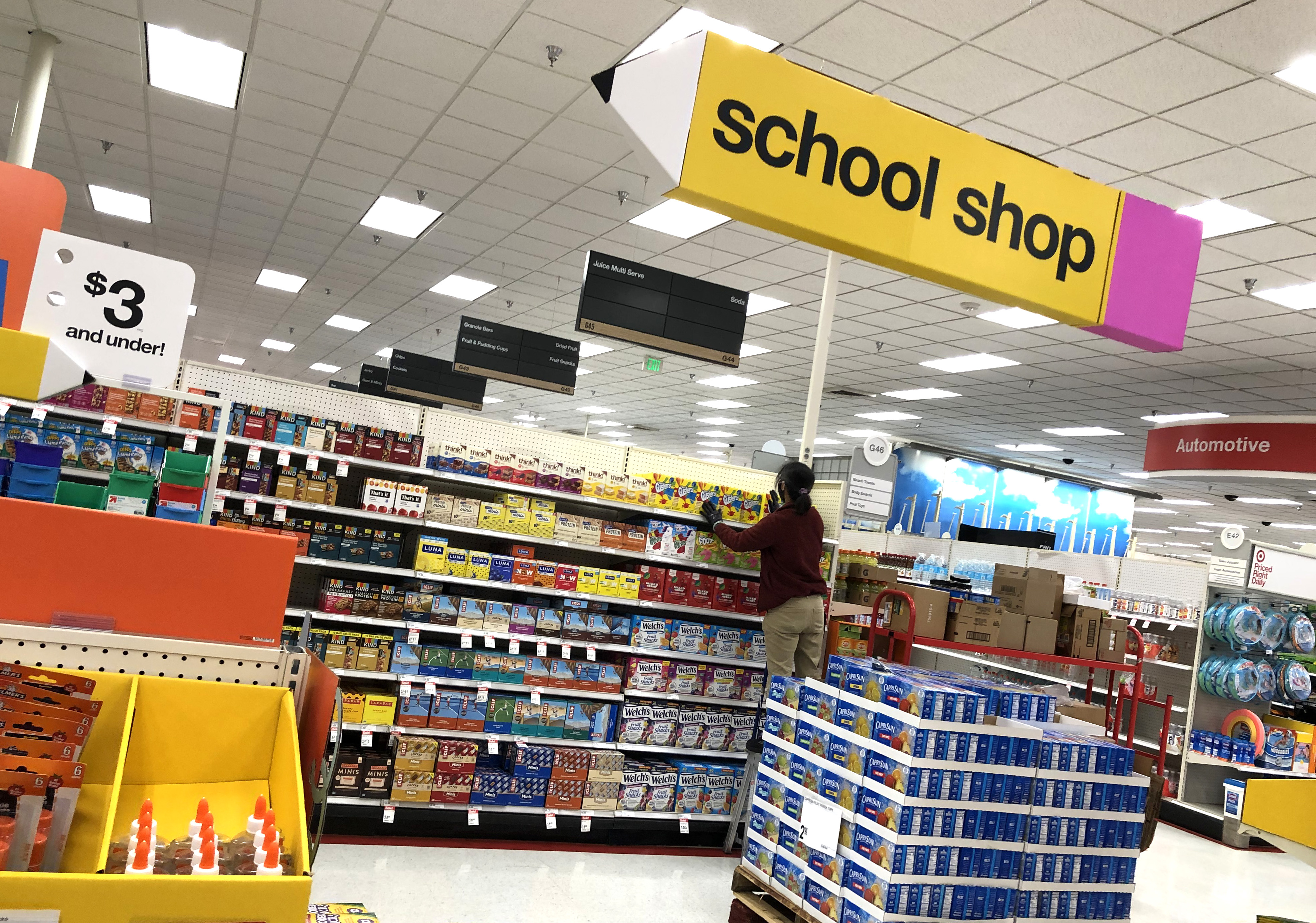 COLMA, CALIFORNIA - AUGUST 03: A worker stocks shelves of back-to-school supplies at a Target store on August 03, 2020 in Colma, California. In the midst of the ongoing coronavirus pandemic, back-to-school shopping has mostly moved to online sales, with purchases shifting from clothing to laptop computers and home schooling supplies. (Photo by Justin Sullivan/Getty Images)