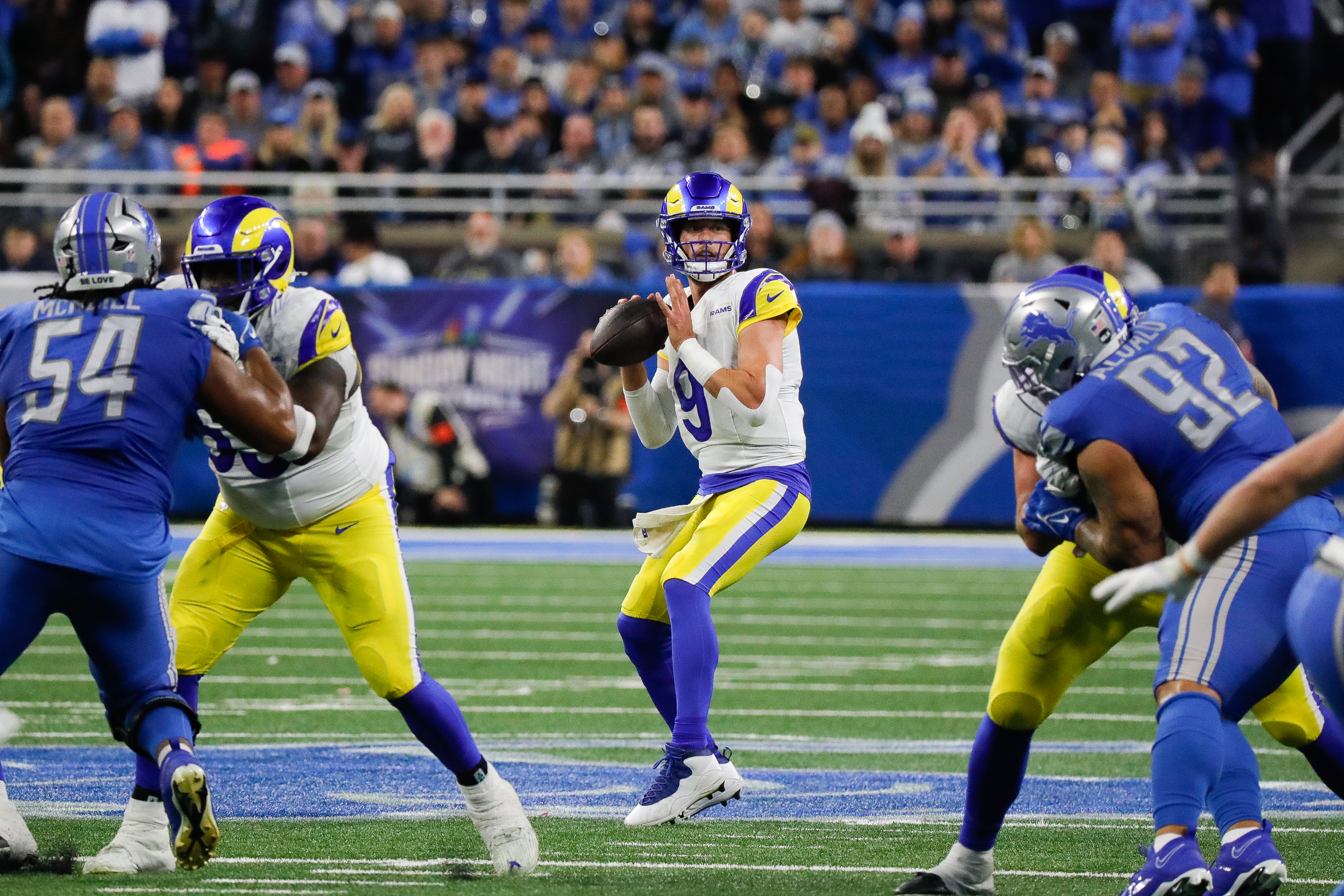 Rams quarterback Matthew Stafford looks to pass under pressure from the Detroit Lions defense 