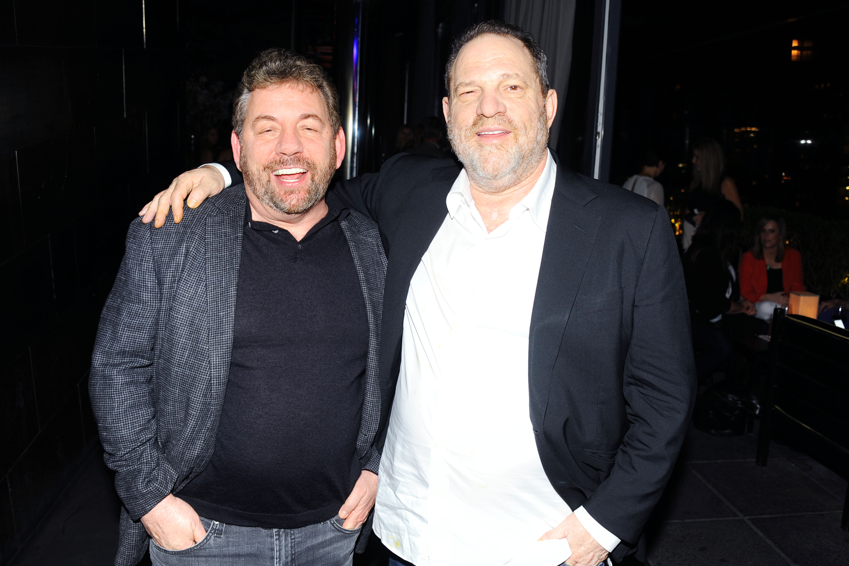 James Dolan smiling and posing with Harvey Weinstein