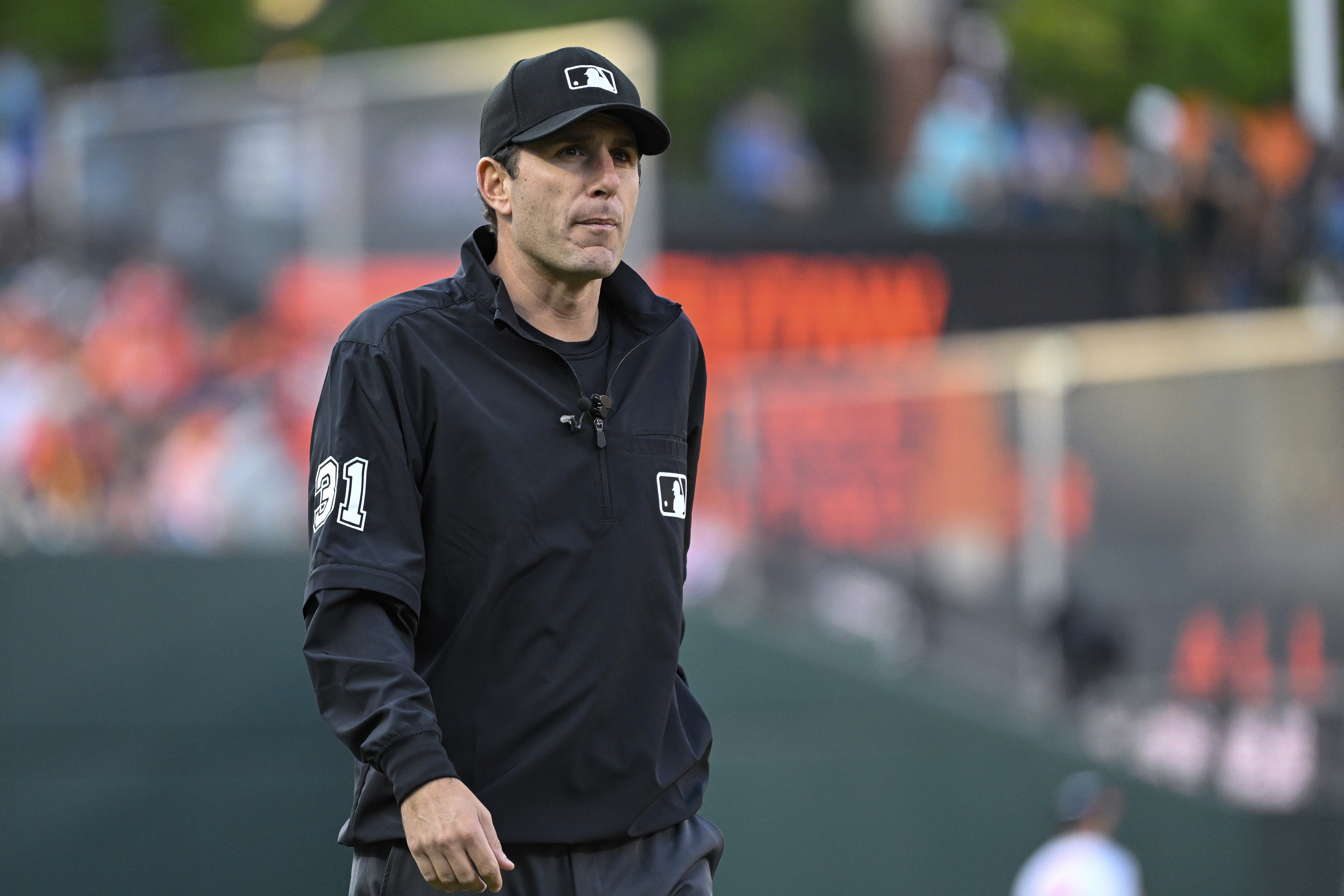 FILE - Umpire Pat Hoberg looks on during a baseball game between the Baltimore Orioles.