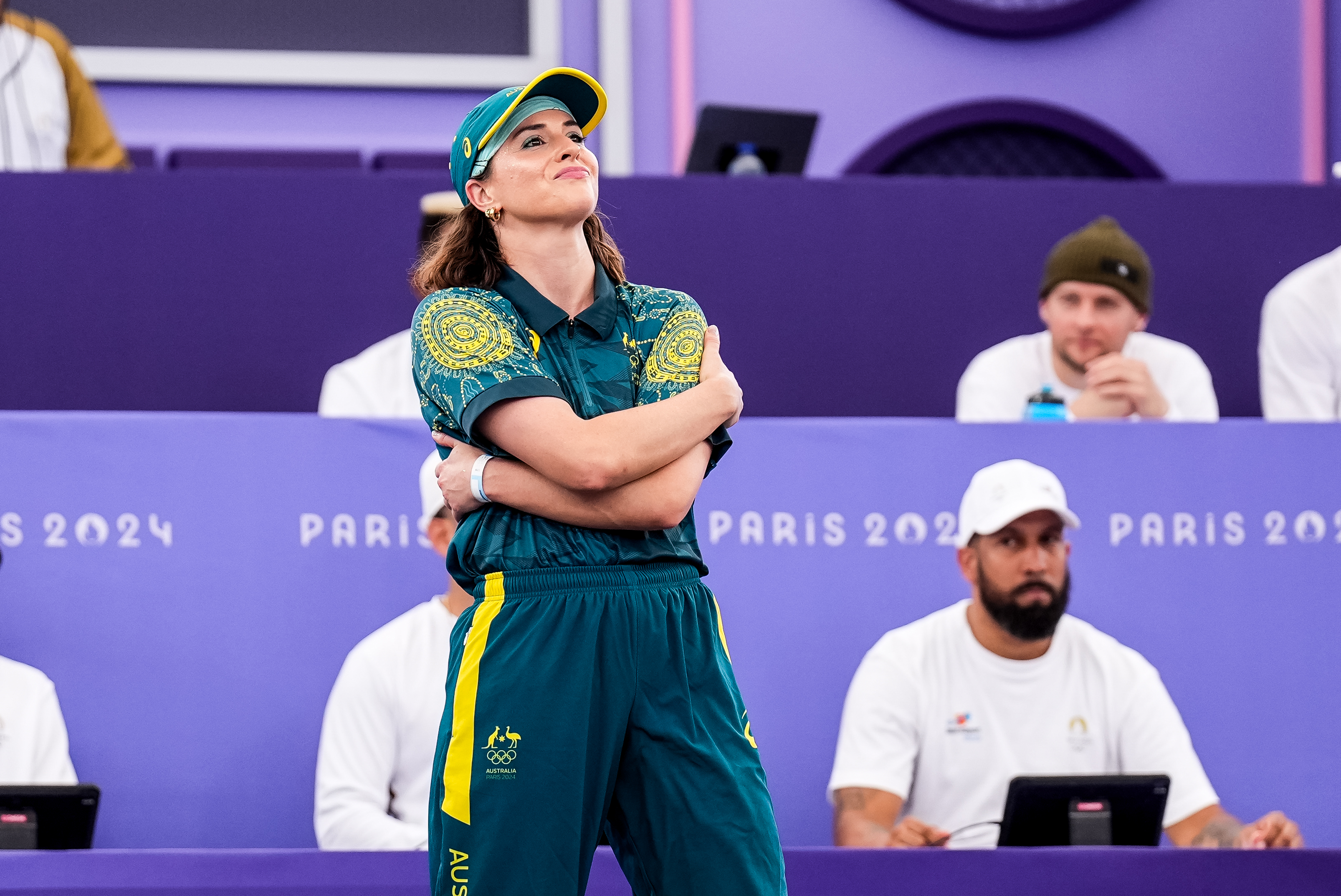 Australian B-Girl Raygun wraps her arms around her torso before competing at the Paris Olympics