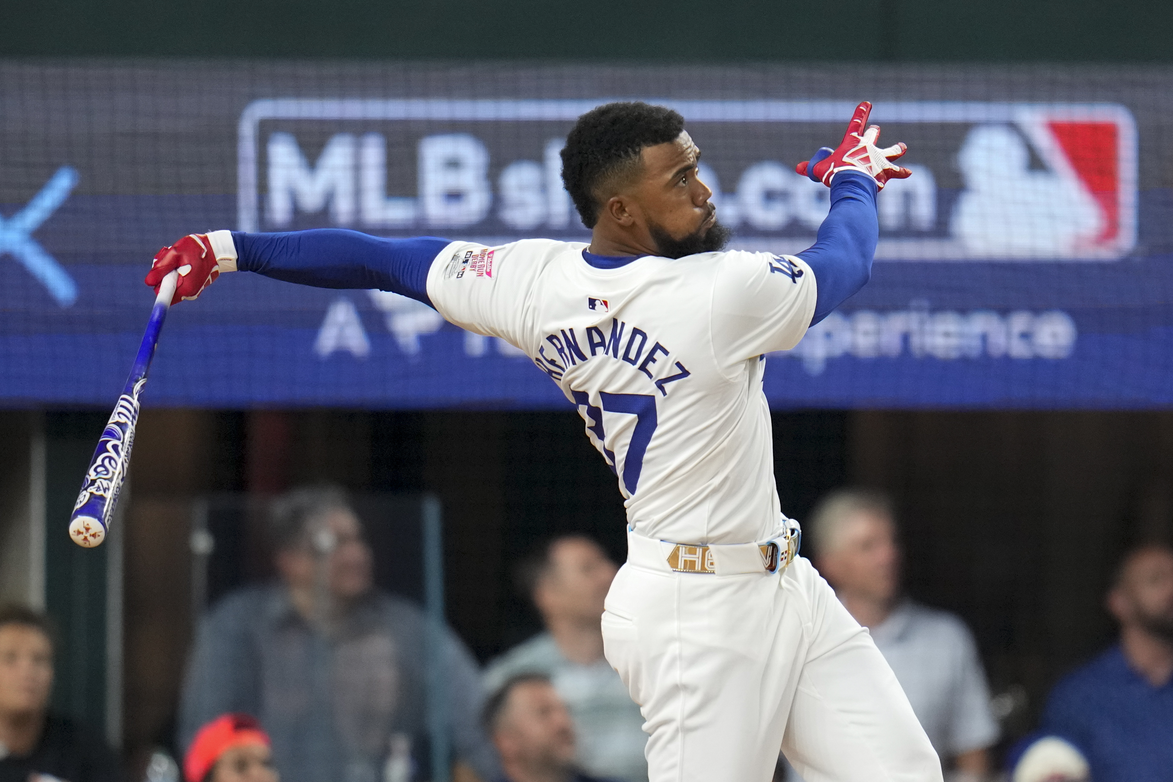 Teoscar Hernández follows through on a swing during the MLB baseball All-Star Home Run Derby