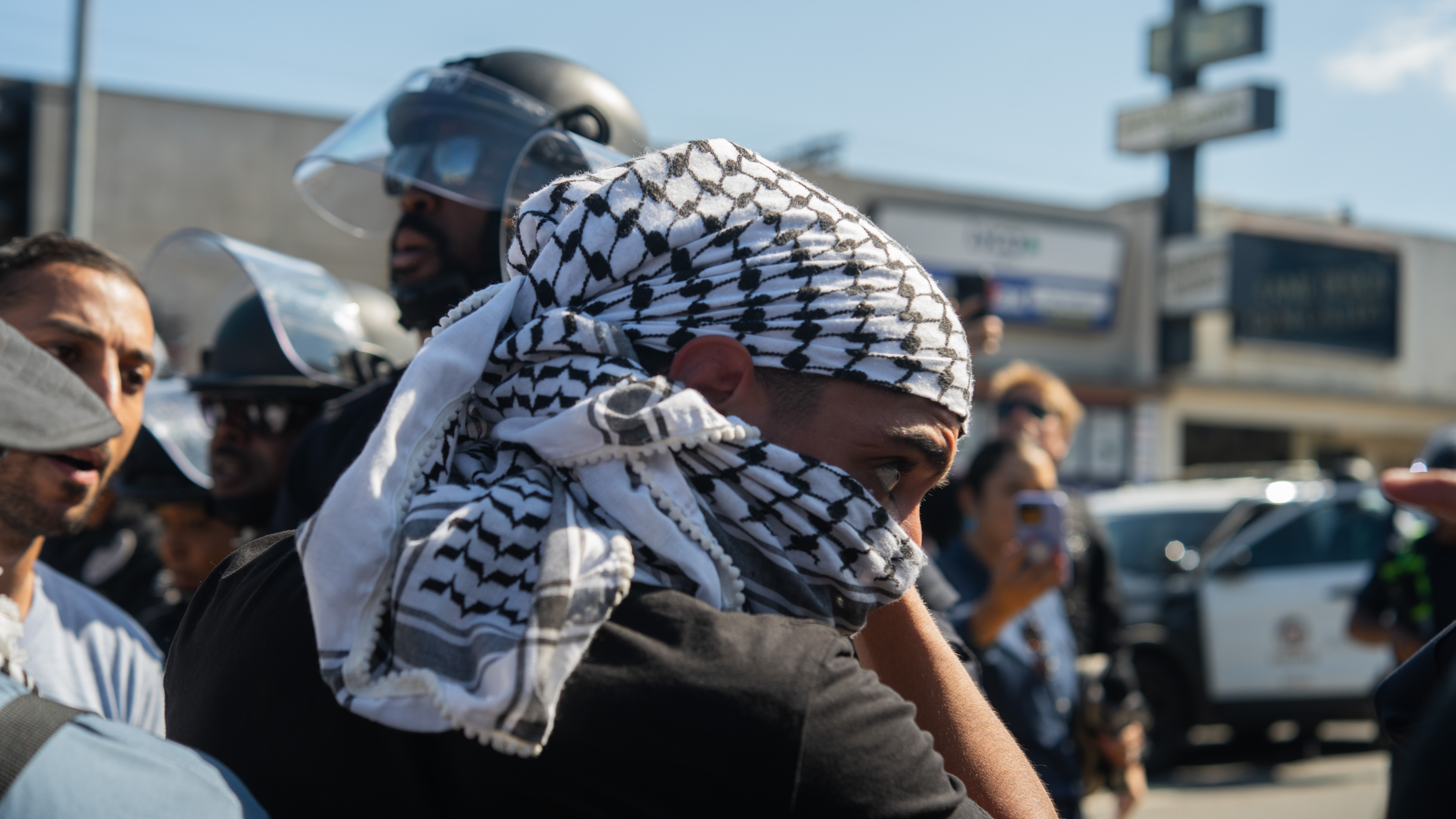 Pro-Palestine protesters are trying to assemble outside of Adas Torah, a synagogue where they believe land in Israel is being sold that they view as stolen land. The pro-Israel side is not wanting the pro-Palestine supporters in the Pico Robertson neighborhood and is trying to chase, mace, and beat the pro-Palestine supporters out of the area, in Los Angeles, USA, on July 23, 2024. (Photo by Shay Horse/NurPhoto via Getty Images)