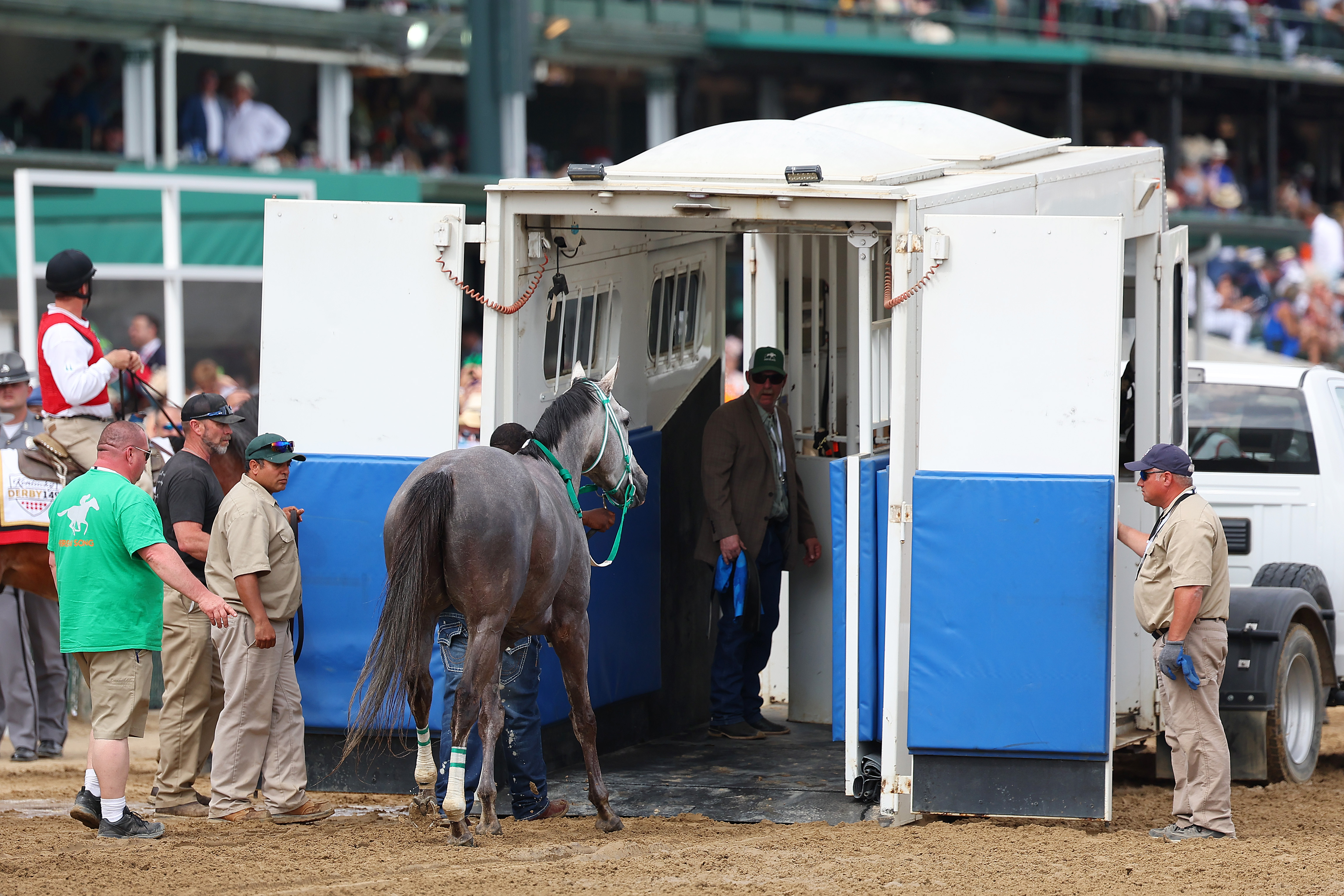 LOUISVILLE, KENTUCKY - MAY 06: Here Mi Song is lead into a equine ambulance after racing in the tenth race.