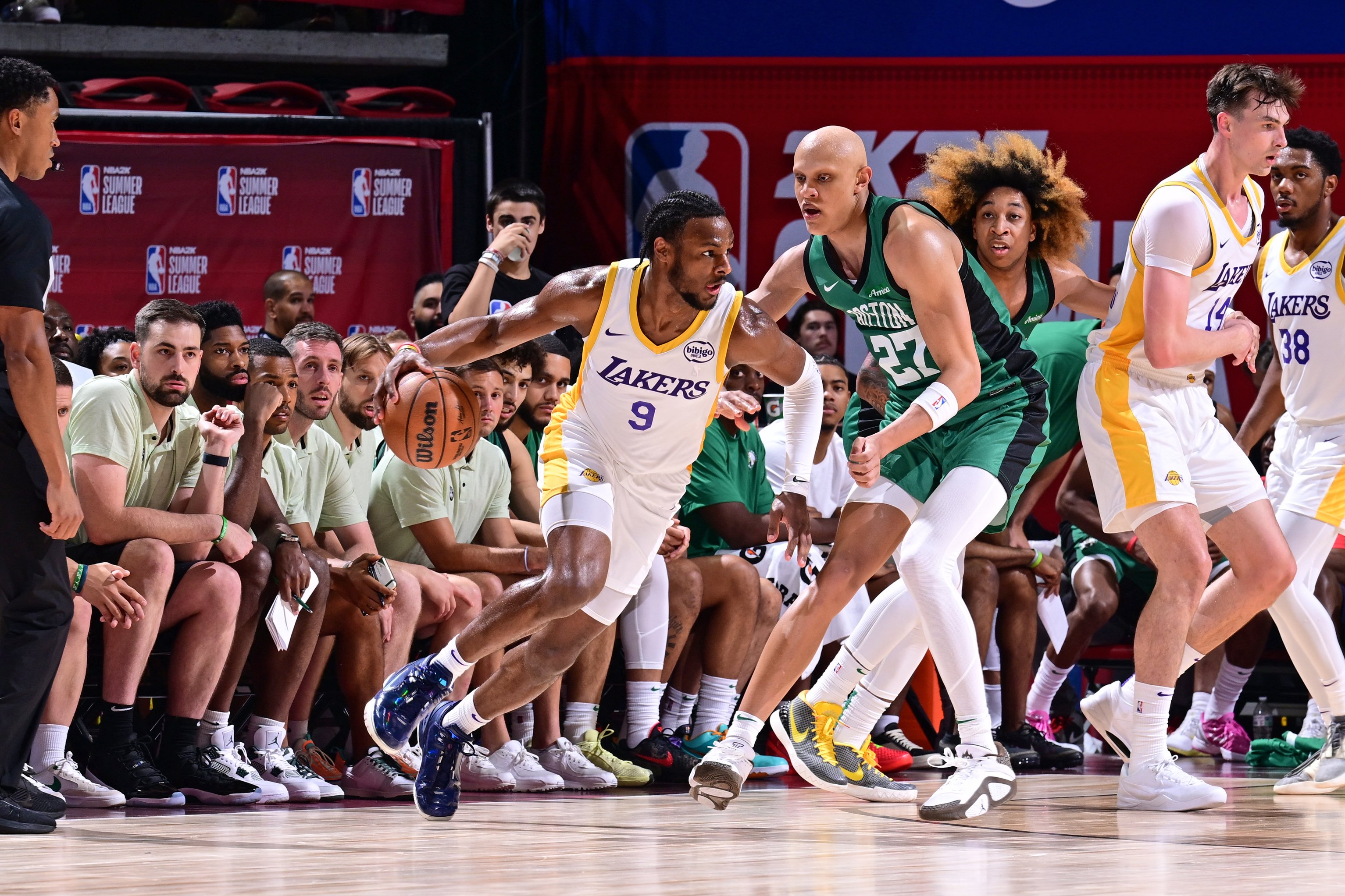 Bronny James Jr. of Los Angeles Lakers dribbles the ball during the game against the Boston Celtics