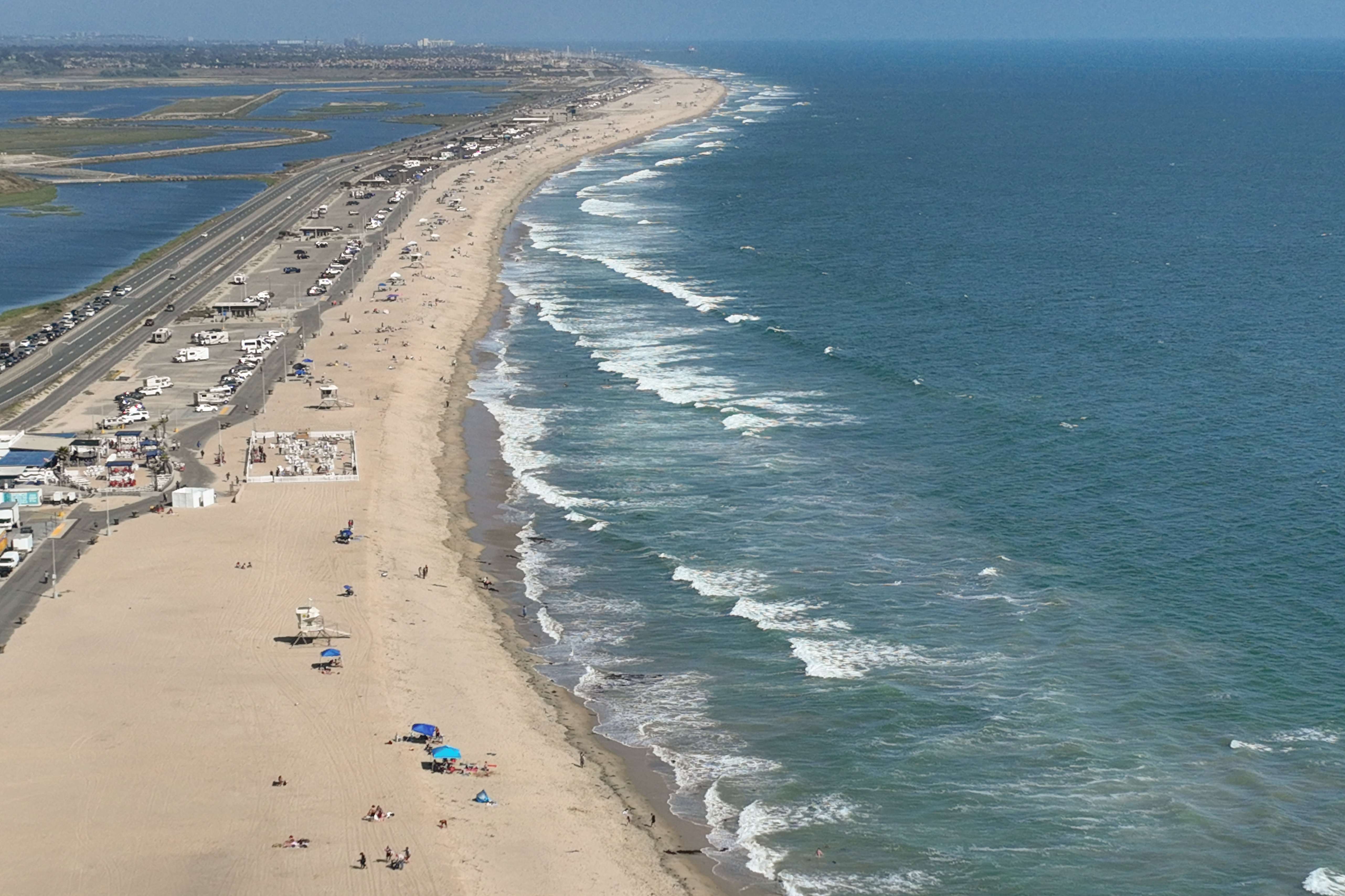 Huntington Beach, CA - June 07: Beach goers enjoy nice weather at Bolsa Chica State Beach in Huntington Beach Friday, June 7, 2024. (Allen J. Schaben / Los Angeles Times)