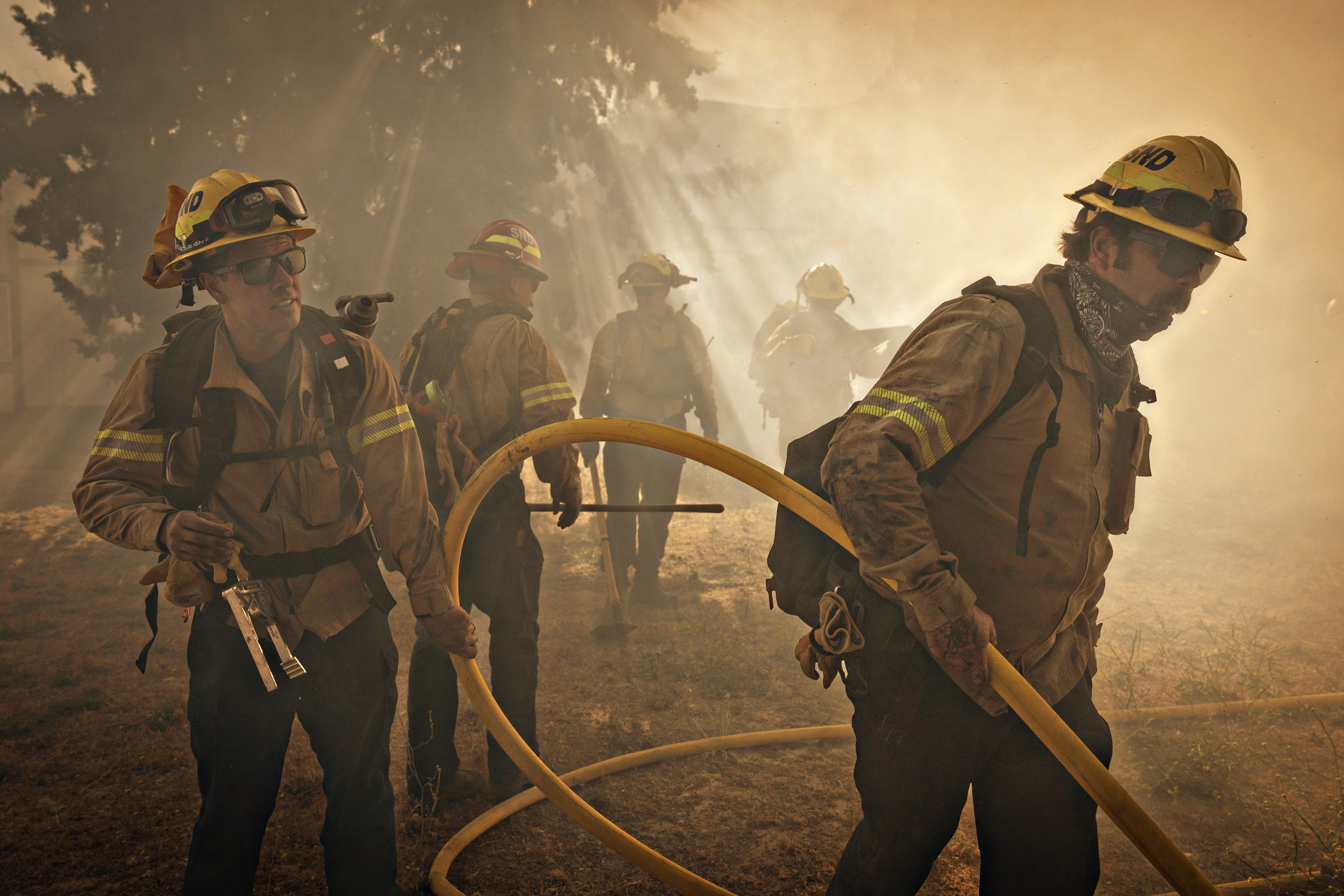 Gorman, CA - June 16: On Orwin road fire crews battle a hot spot at the Gorman Brush Fire in northern Los Angeles County on Sunday, June 16, 2024 in Gorman, CA. (Jason Armond / Los Angeles Times)