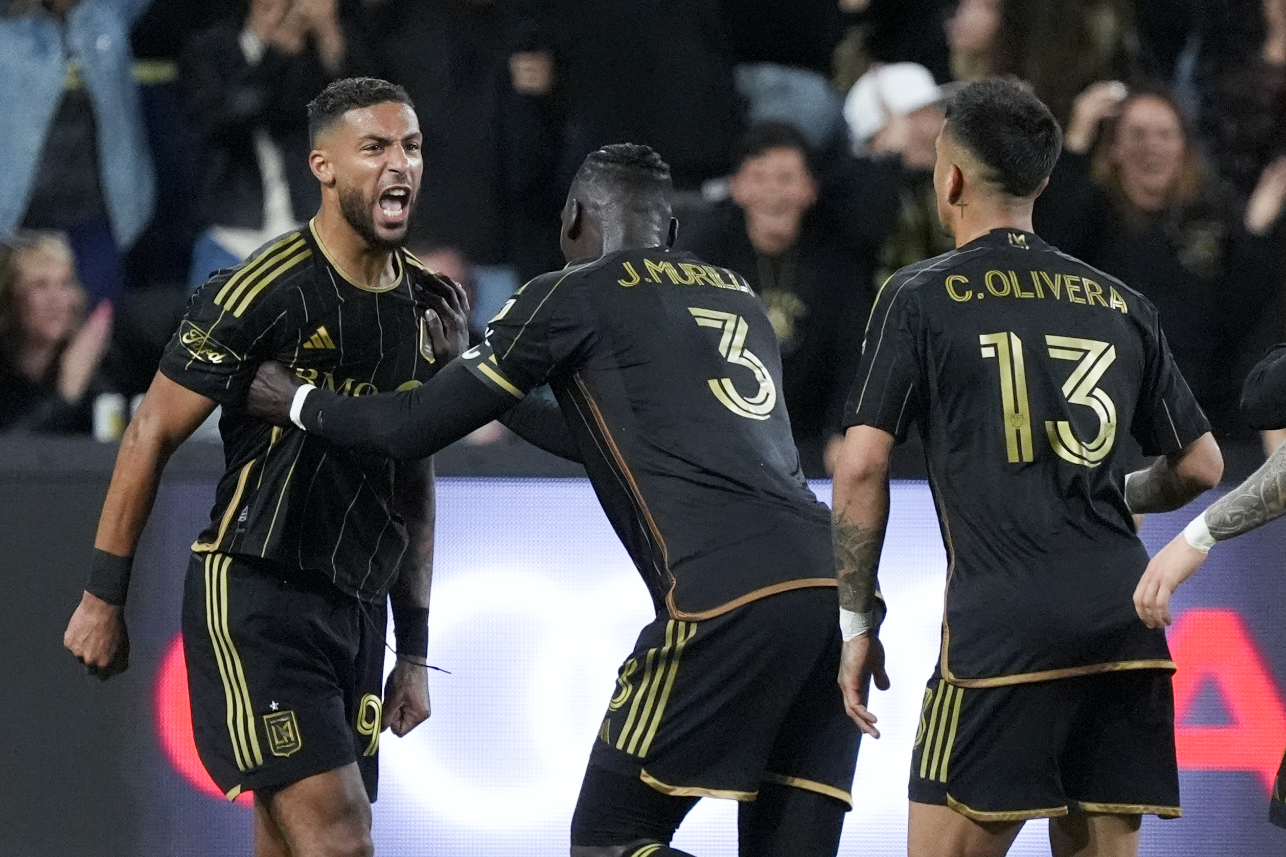 Los Angeles FC forward Denis Bouanga, left, celebrates his goal against the Portland Timbers.