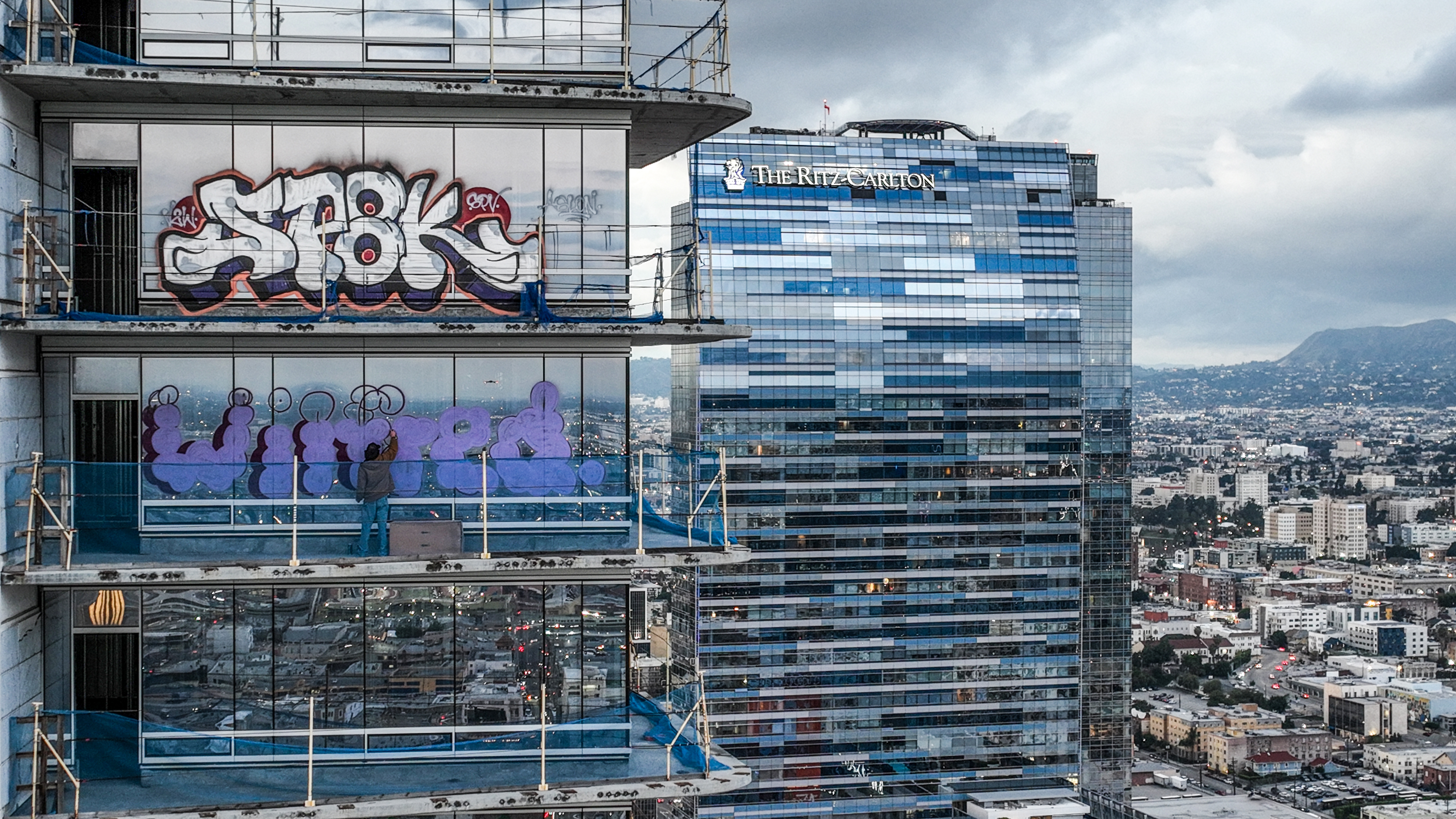 Taggers have graffitied what appears to be more than 25 stories of a downtown Los Angeles skyscraper