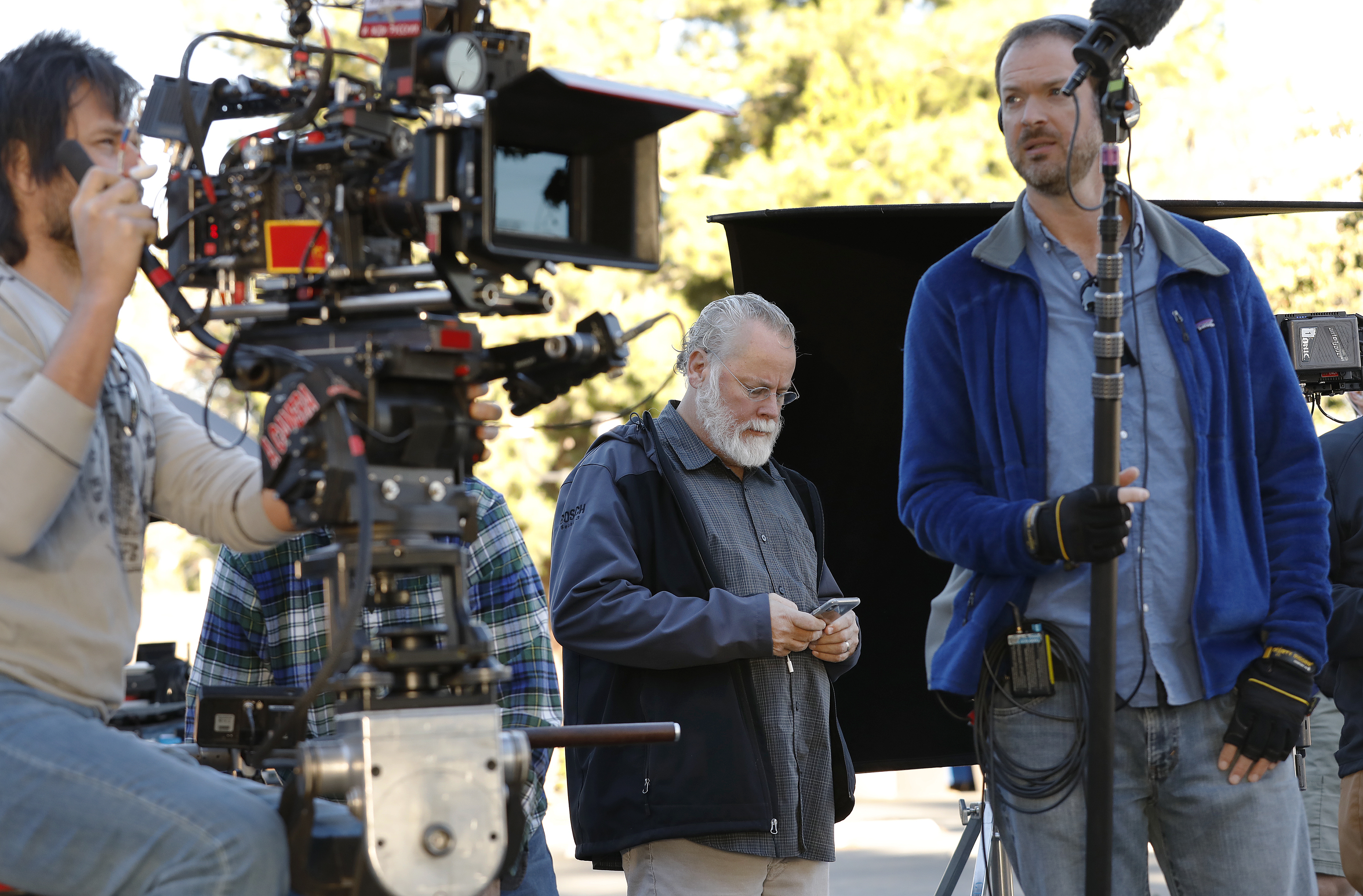 LOS ANGELES, CA - OCTOBER 16, 2018 - Author Michael Connelly, center, on the film set shooting of "Bosch" Season 5 in the San Fernando Valley on October 16, 2018. Detective Mitzi Roberts, is the inspiration of Connelly's new character in the show, Renee Ballard. (Al Seib / Los Angeles Times)