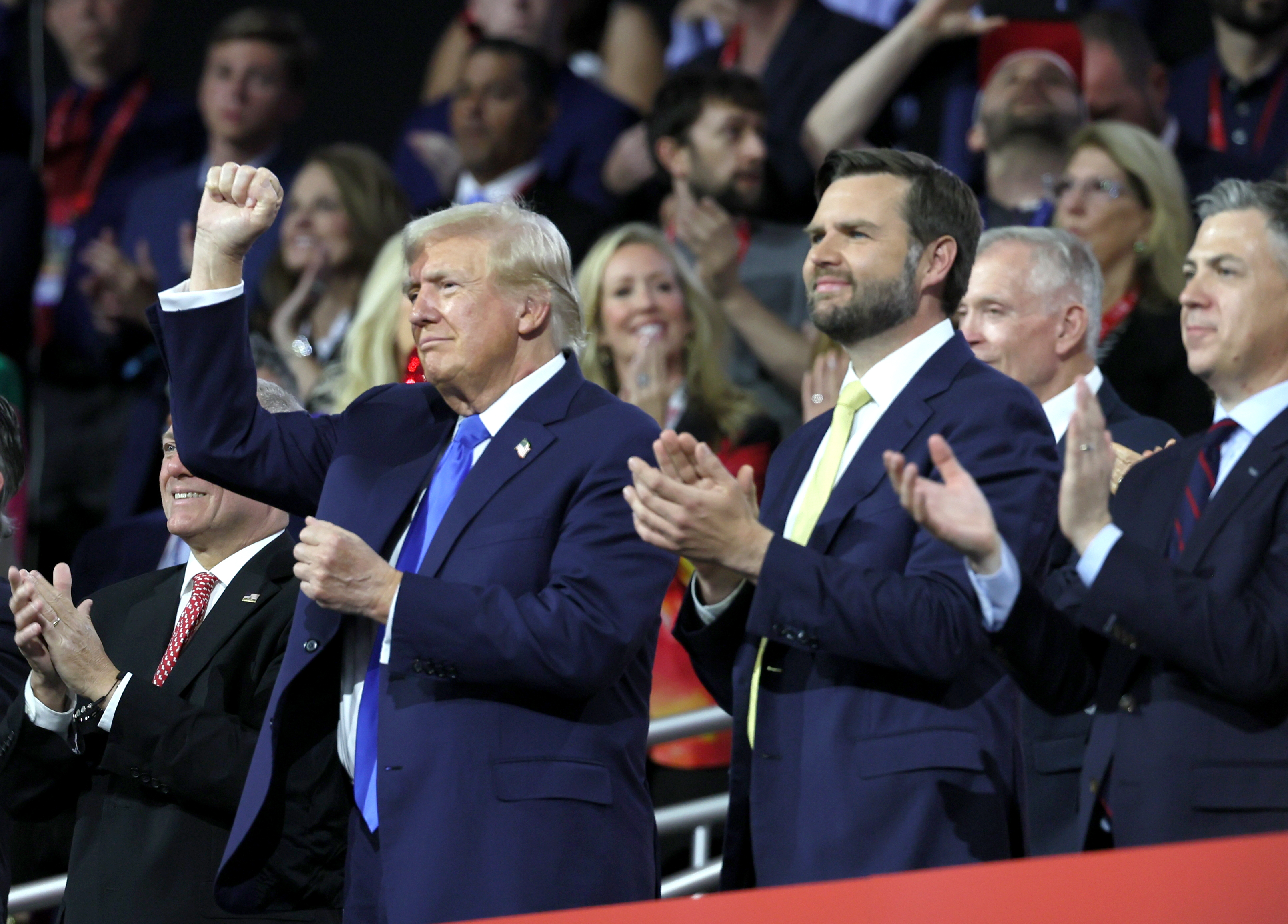 MILWAUKEE, WI JULY 16, 2024 -- Republican presidential candidate former President Donald Trump, left, and Republican vice presidential candidate Sen. JD Vance react to a speech during the Republican National Convention on Tuesday, July 16, 2024. (Robert Gauthier / Los Angeles Times)