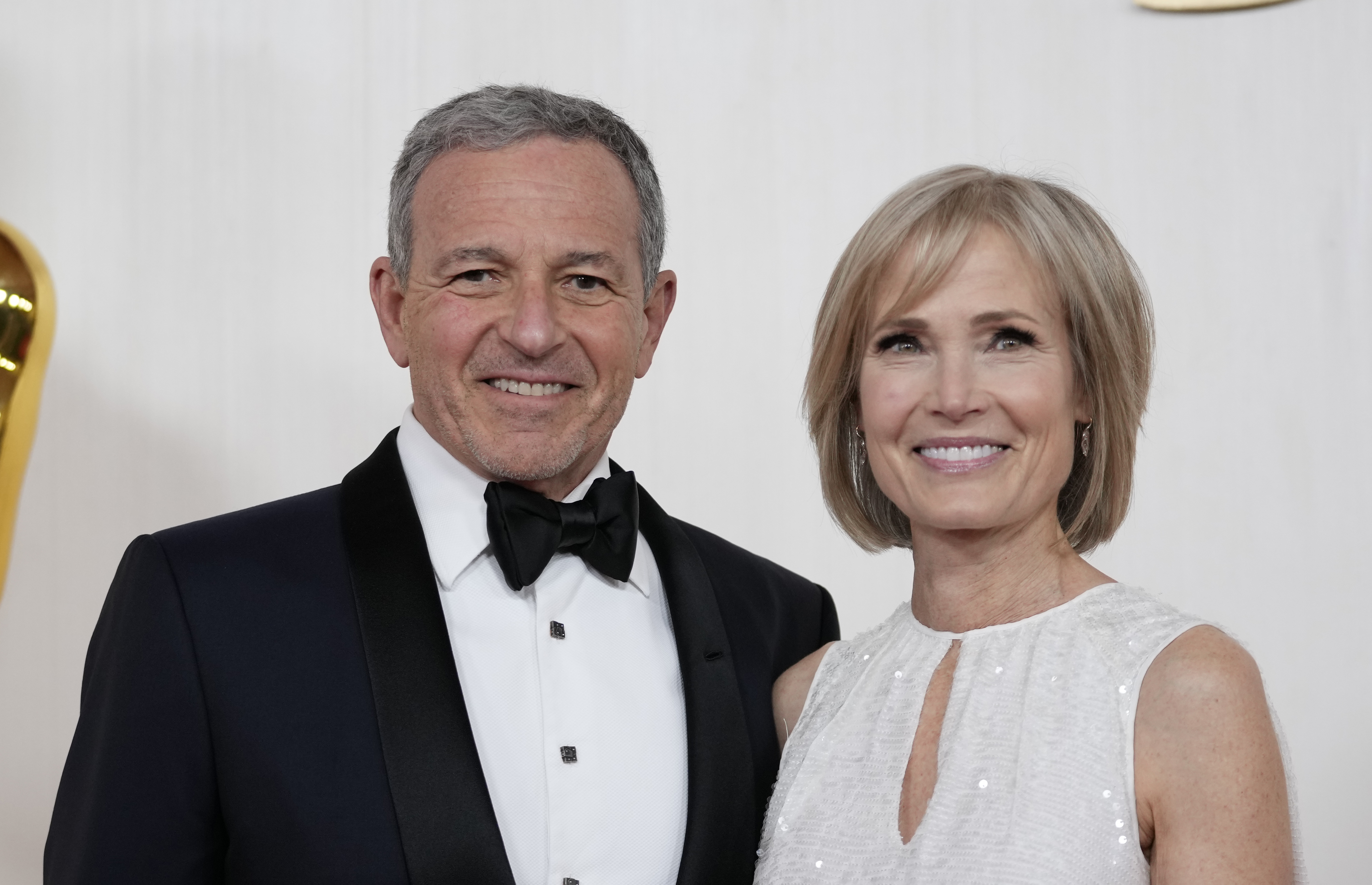 Bob Iger, left, and Willow Bay arrive at the Oscars on Sunday, March 10, 2024, at the Dolby Theatre in Los Angeles. (AP Photo/Ashley Landis)