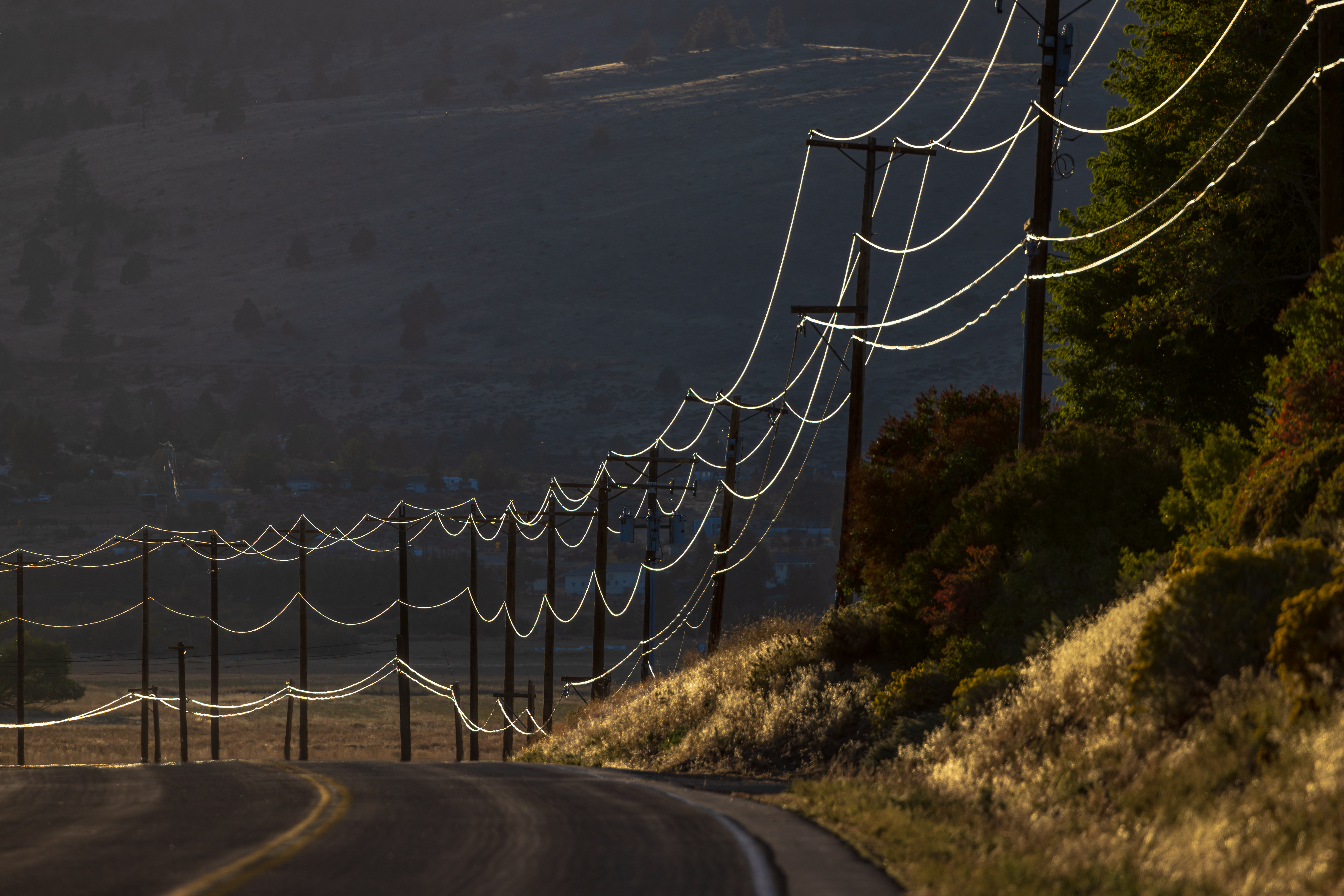 SUSANVILLE, CA - SEPTEMBER 27: Powers lines shine in sun light along Richmond Road on Wednesday, Sept. 27, 2023 in Susanville, CA. (Irfan Khan / Los Angeles Times)
