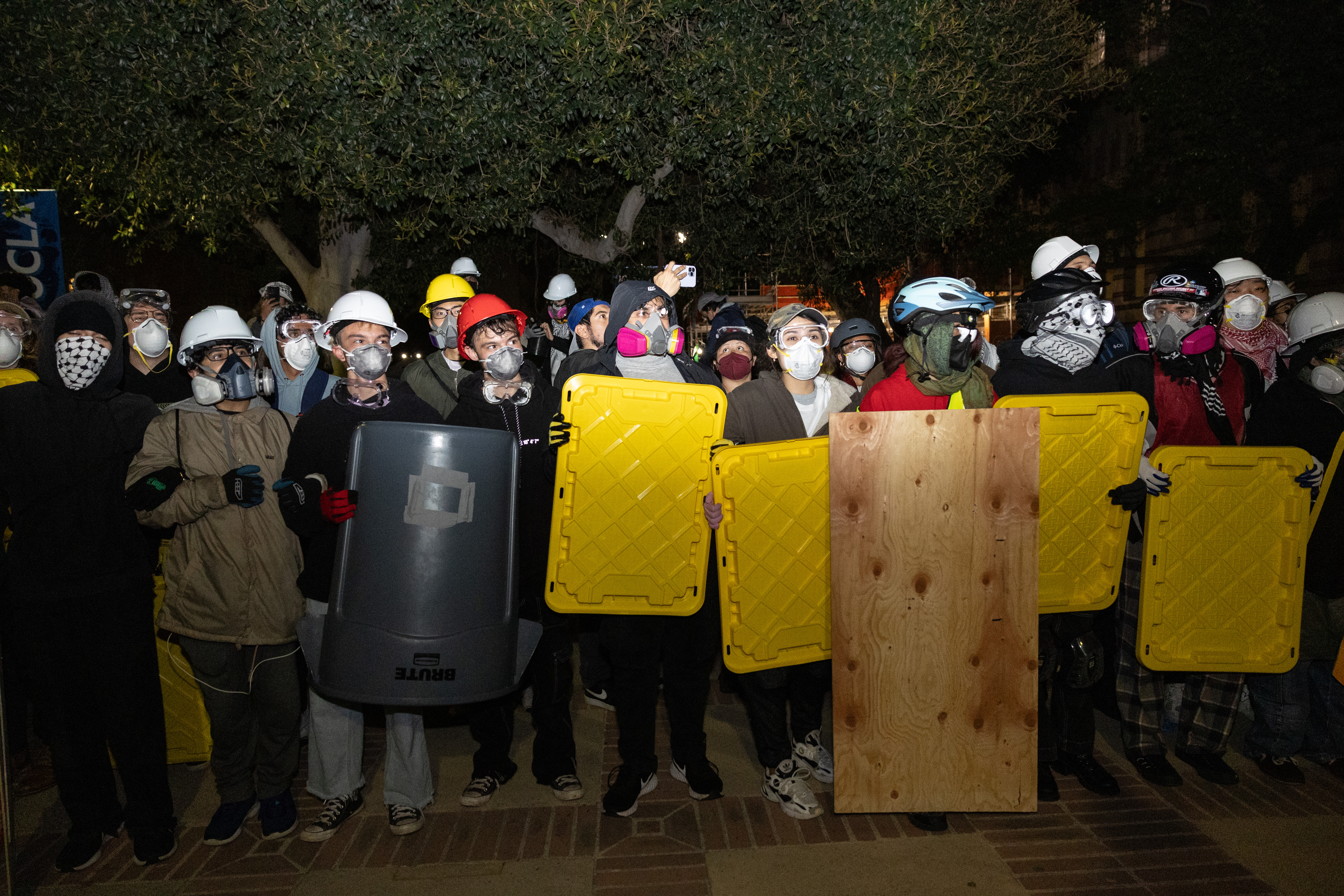 Demonstrators in a Pro-Palestinian encampment at UCLA face off against authorities