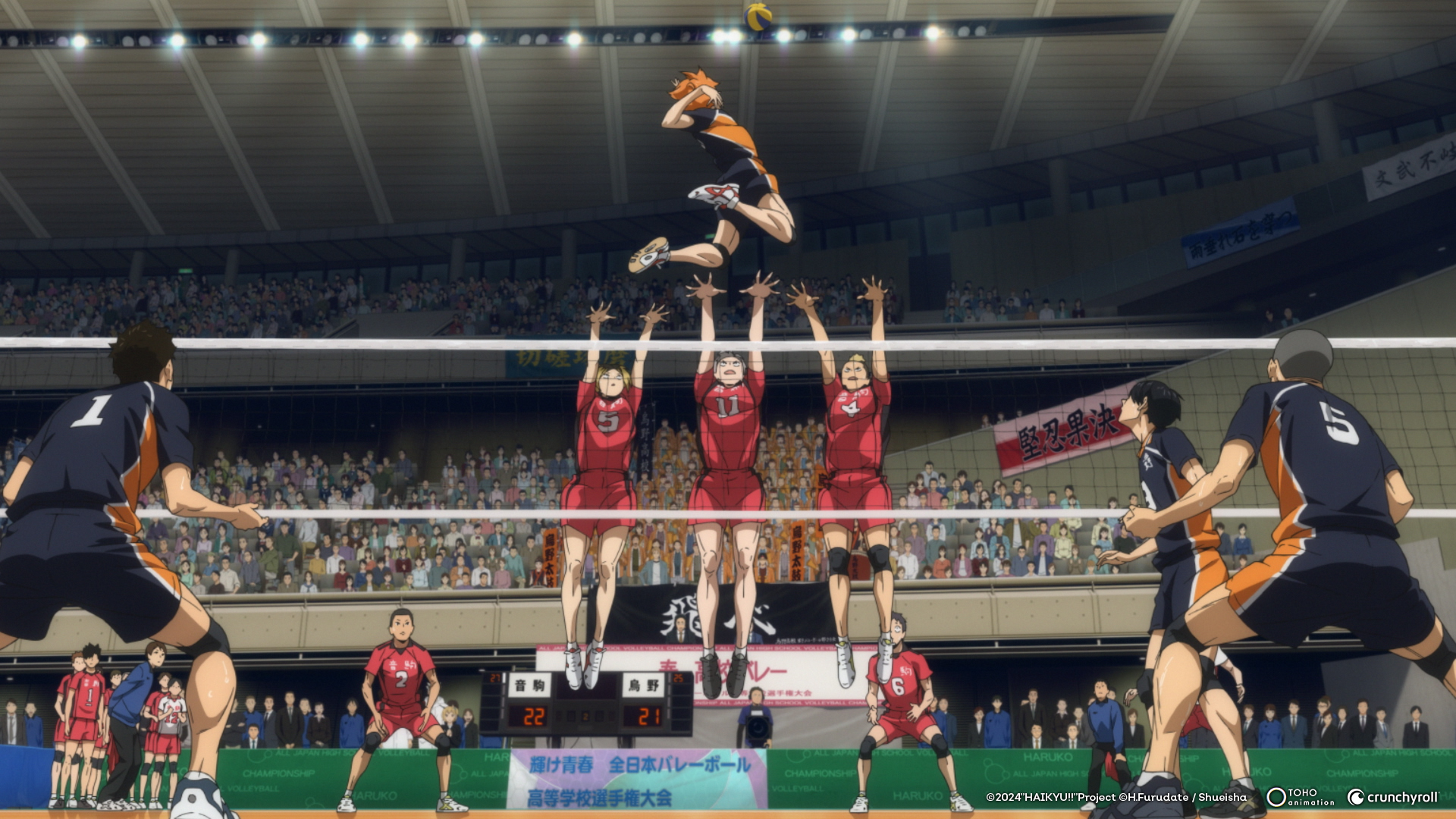 An animated volleyball player jumps high in the air, preparing to spike the ball over three defenders.