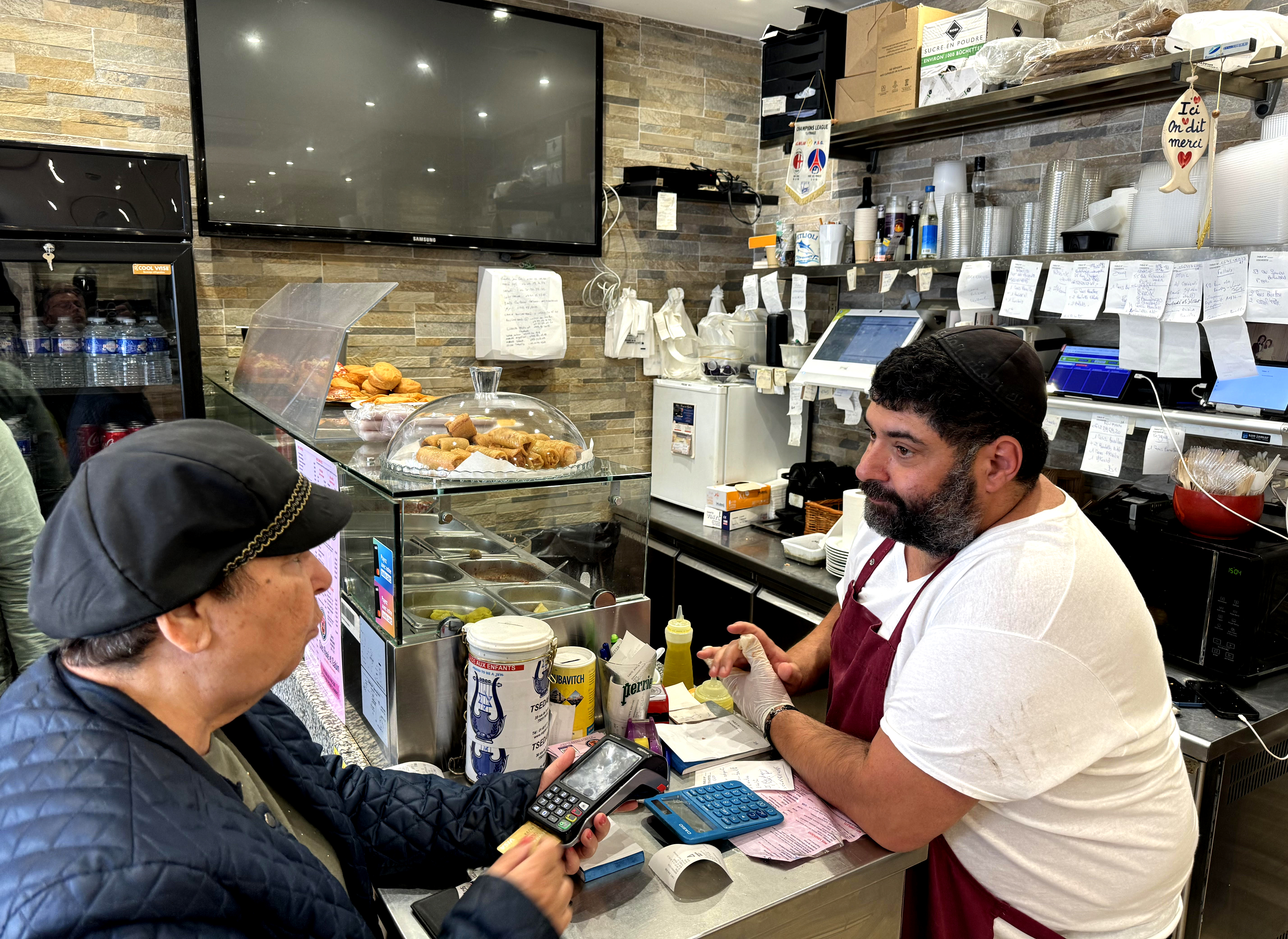 At Chez Rene et Gabin restaurant in Paris, manager Stéphane Bsiri works the counter.