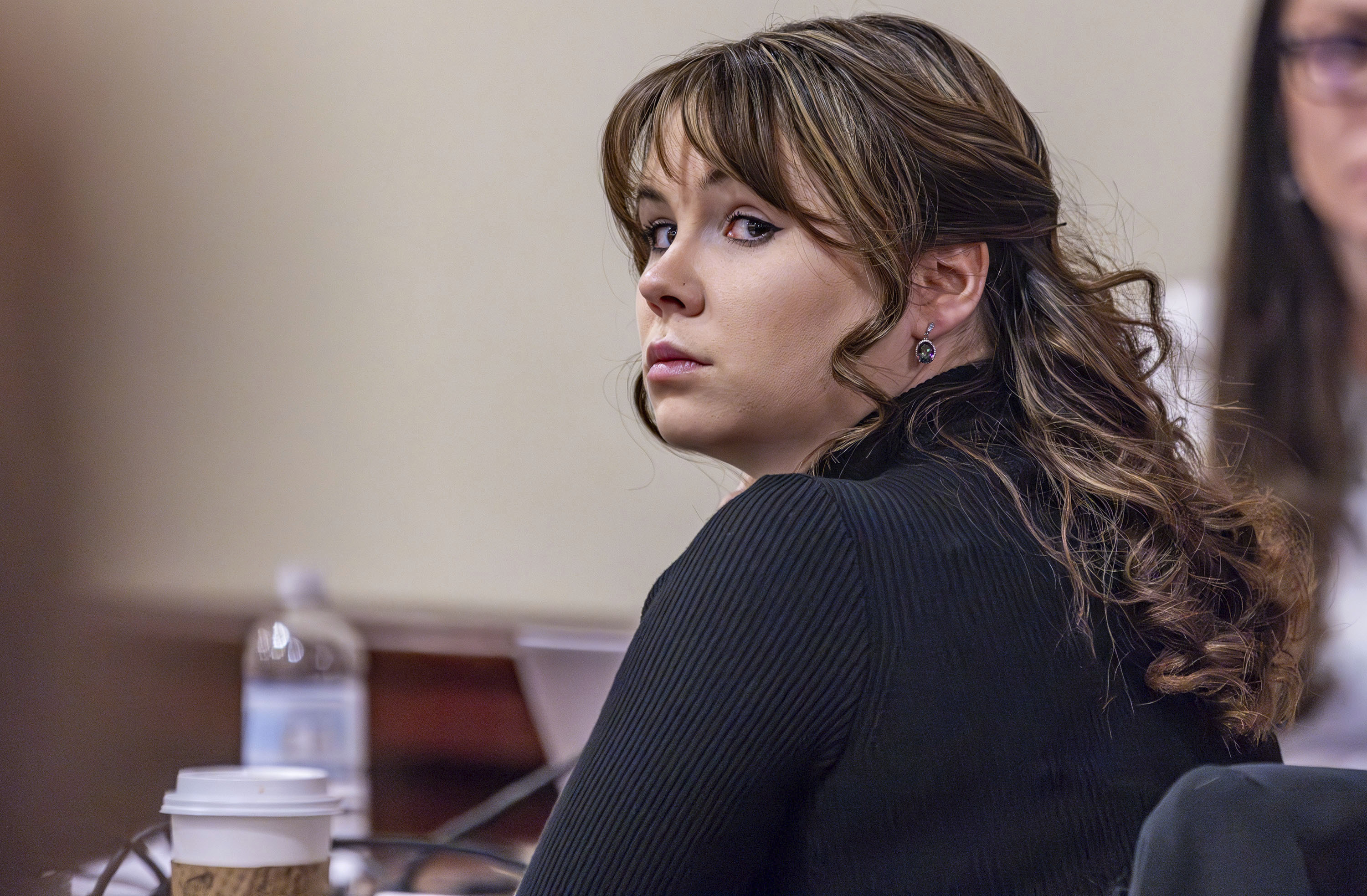 Hannah Gutierrez-Reed, the former armorer at the movie "Rust", listens to closing arguments in her trial at district court on Wednesday, March 6, 2024, in Santa Fe, N.M. (Luis Sánchez Saturno/Santa Fe New Mexican via AP, Pool)