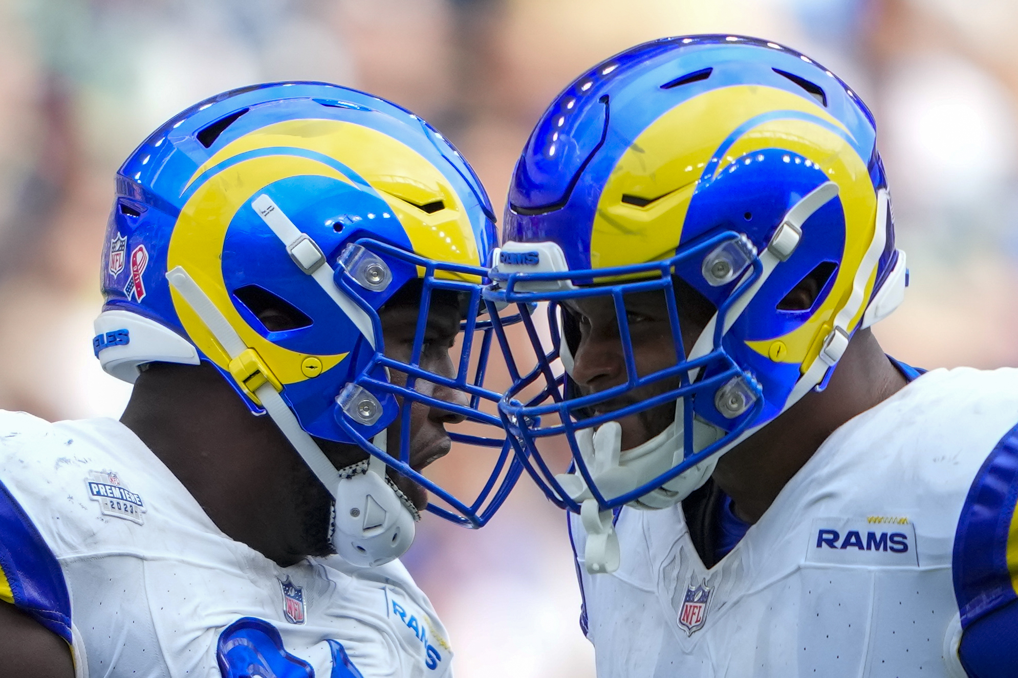 Los Angeles Rams defensive tackle Kobie Turner and defensive tackle Aaron Donald celebrates.