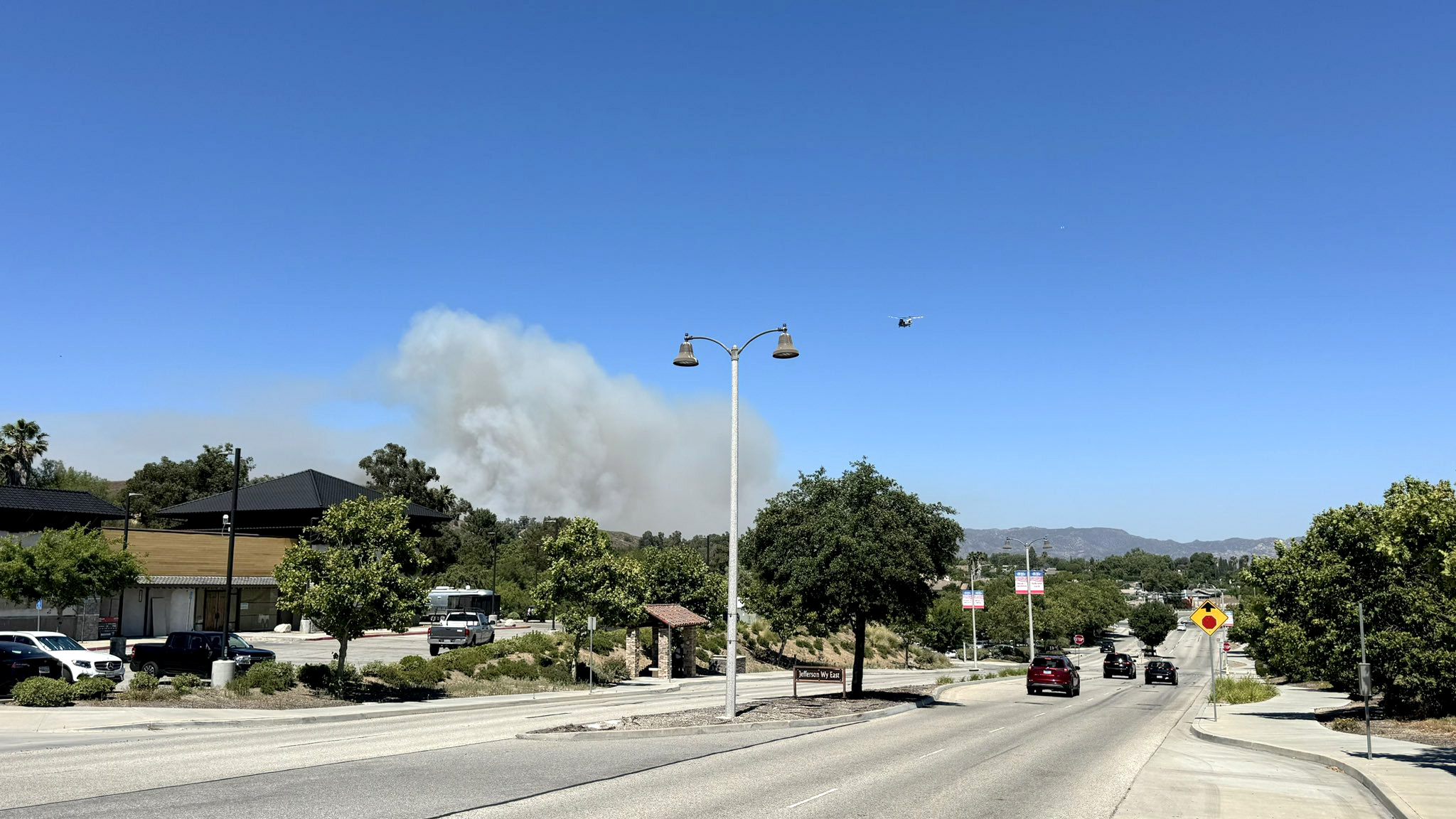 #Sharpfire; UPDATE - the fire is currently at 43 acres measured by sensory aircraft. This is a second alarm brushfire burning in Simi Valley off Sharp rd near Ditch rd. There are approximately 200 firefighters on scene. Multiple fixed wing aircraft and helicopters are attacking the fire from the air. Firefighters are using hose lines to attack the fire from multiple fronts.